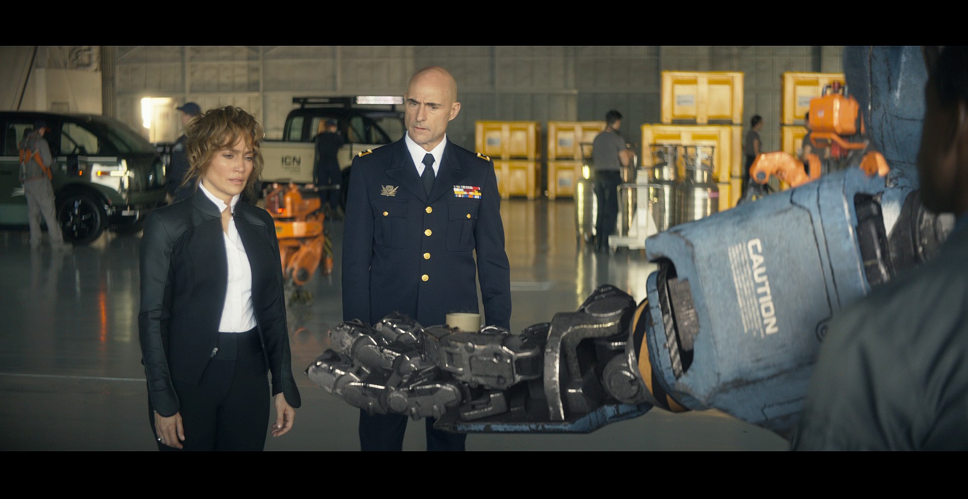 Zoe (Zoe Boyle) offers Agent Shepherd (Jennifer Lopez) a coffee in Atlas (2024), Netflix