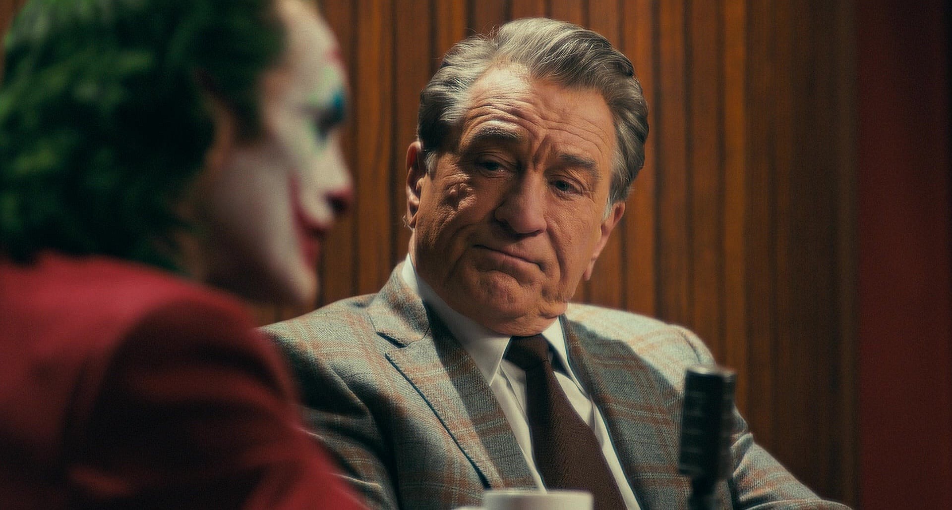 Joaquin Phoenix as Arthur Fleck and Robert De Niro as Murray Franklin in Joker (2019), Warner Bros. Pictures