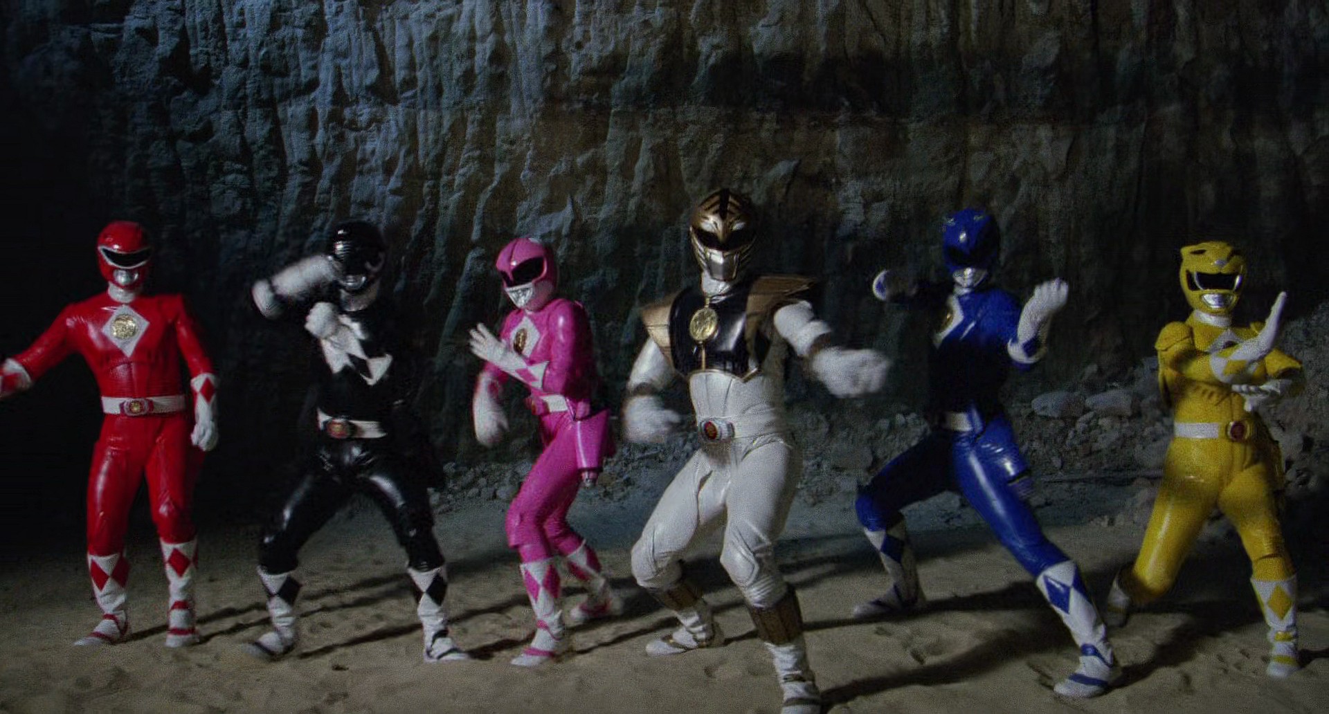 The titular team dons their one-time-only metallic armor in Tommy (Jason David Frank) learns of his connection to the Falcon Ninjetti from Dulcea (Gabrielle Fitzpatrick) in Mighty Morphin Power Rangers: The Movie (1995), Saban Entertainment