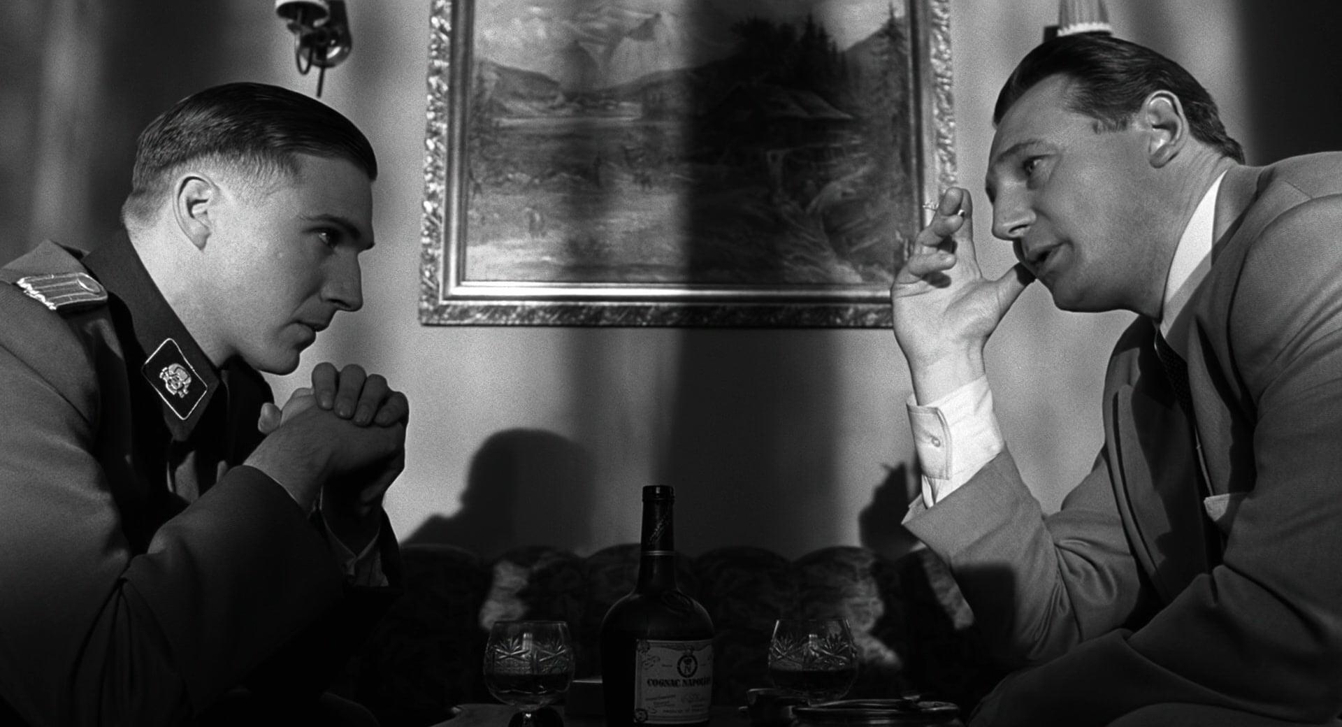Ralph Fiennes as Amon Goeth and Liam Neeson as Oskar Schindler in Schindler's List (1993), Universal Pictures