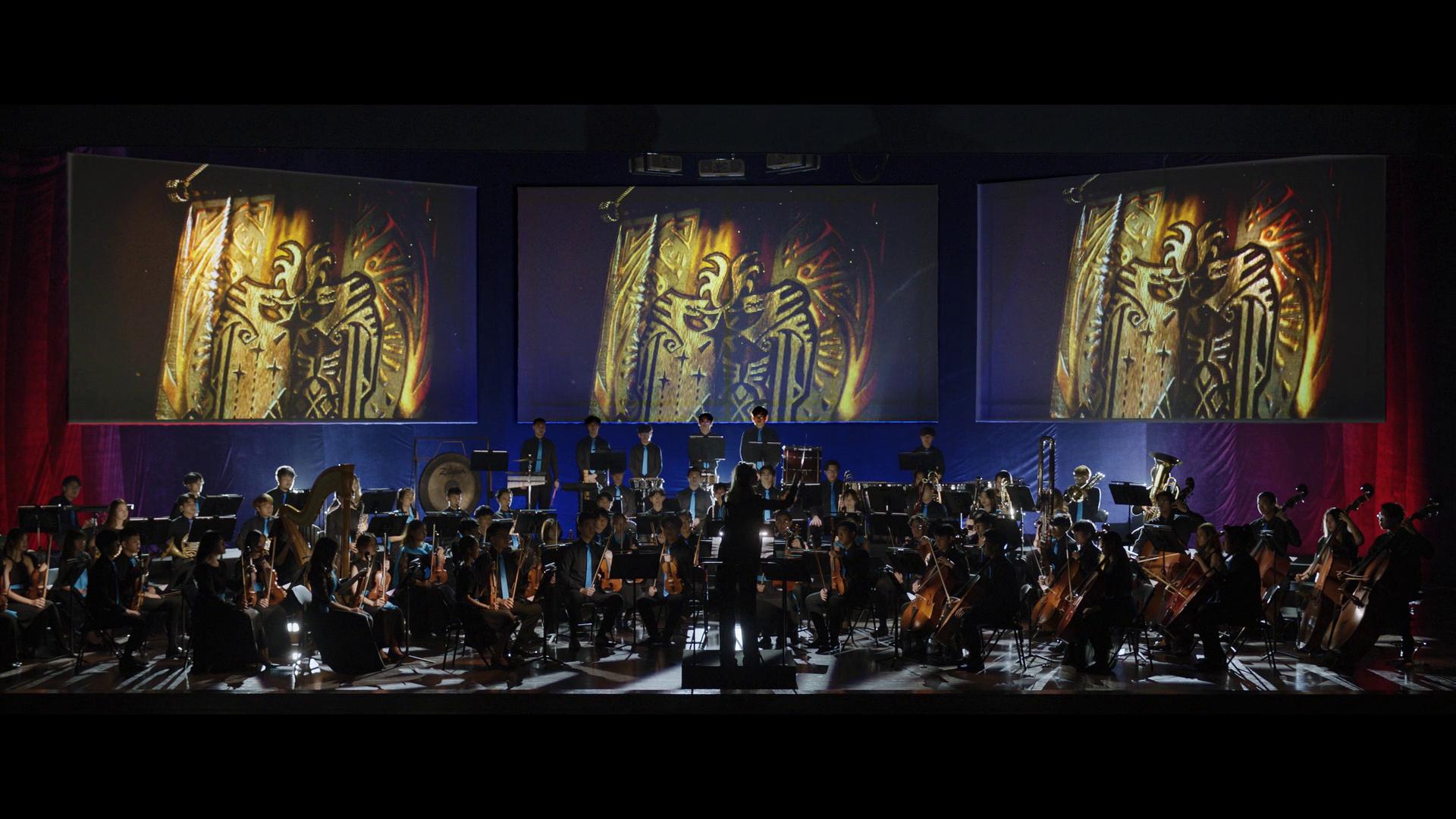 Lydia Tár (Cate Blanchett) prepares to conduct a Monster Hunter-themed performance via Tár (2022), Universal Pictures