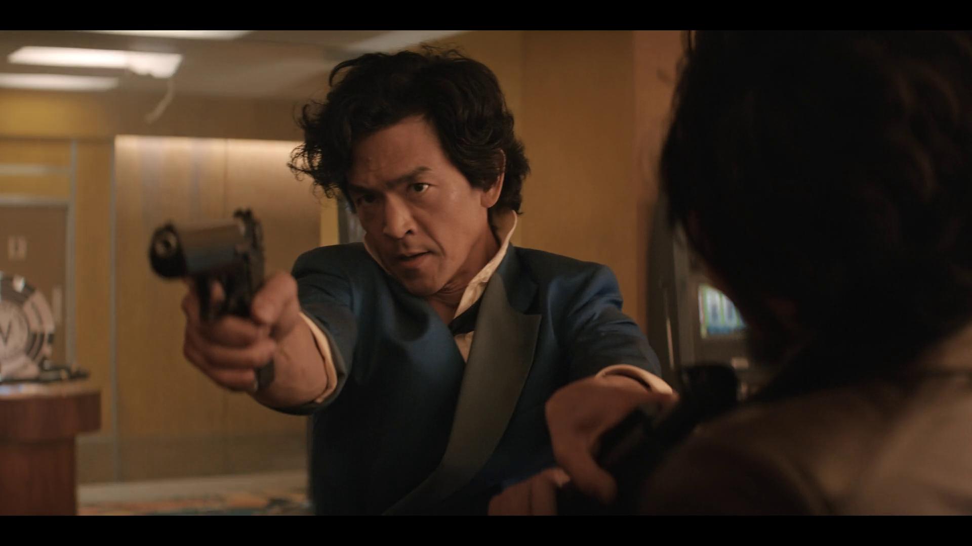 Spike Spiegel (John Cho) draws on Rengie Tanaka (James Hiroyuki Liao) in Cowboy Bebop Season 1 Episode 1 "Cowboy Gospel" (2021), Neflix