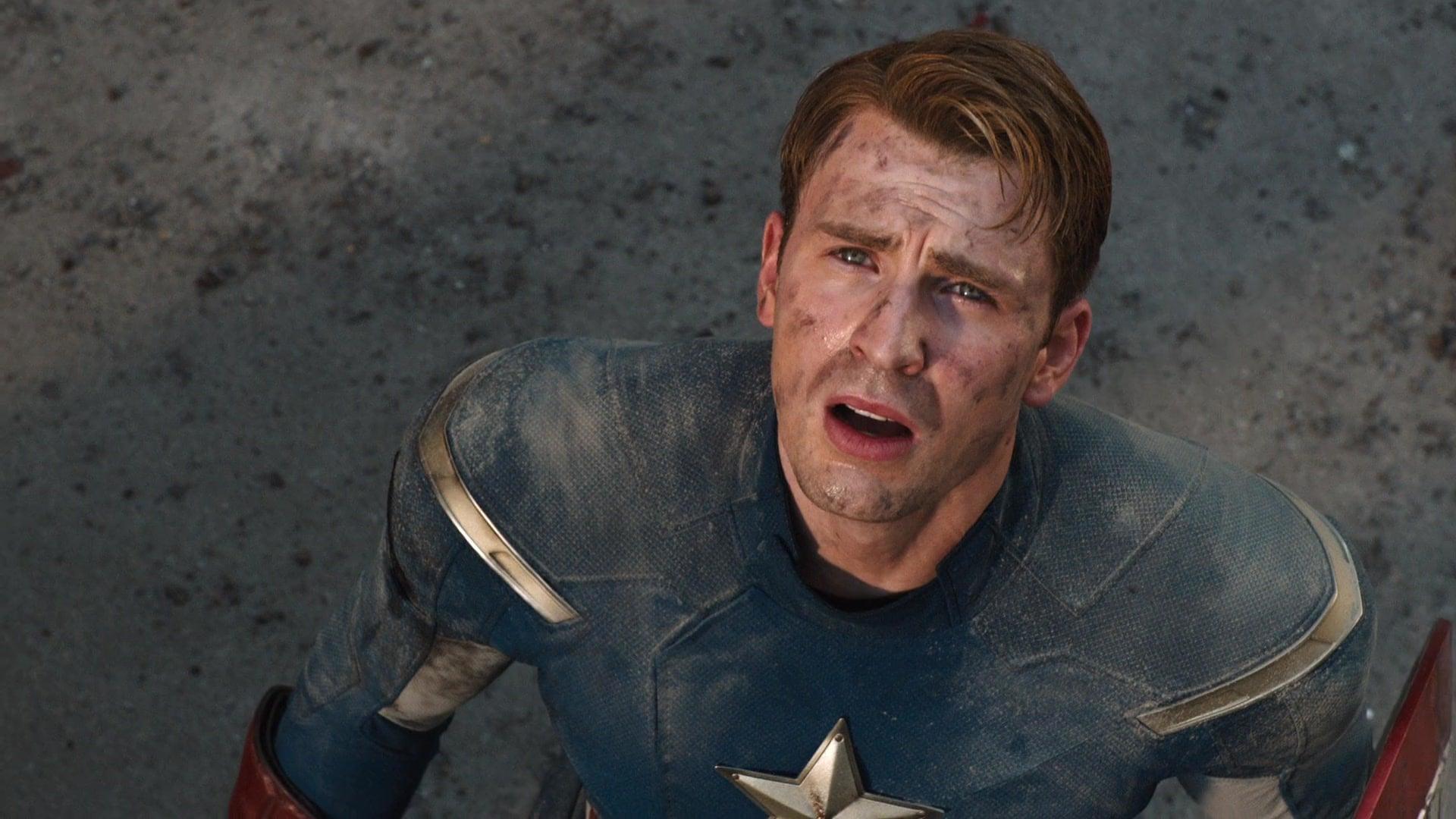 Captain America (Chris Evans) watches on as Iron Man (Robert Downey Jr.) puts an end to The Battle of New York in The Avengers (2012), Marvel Entertainment