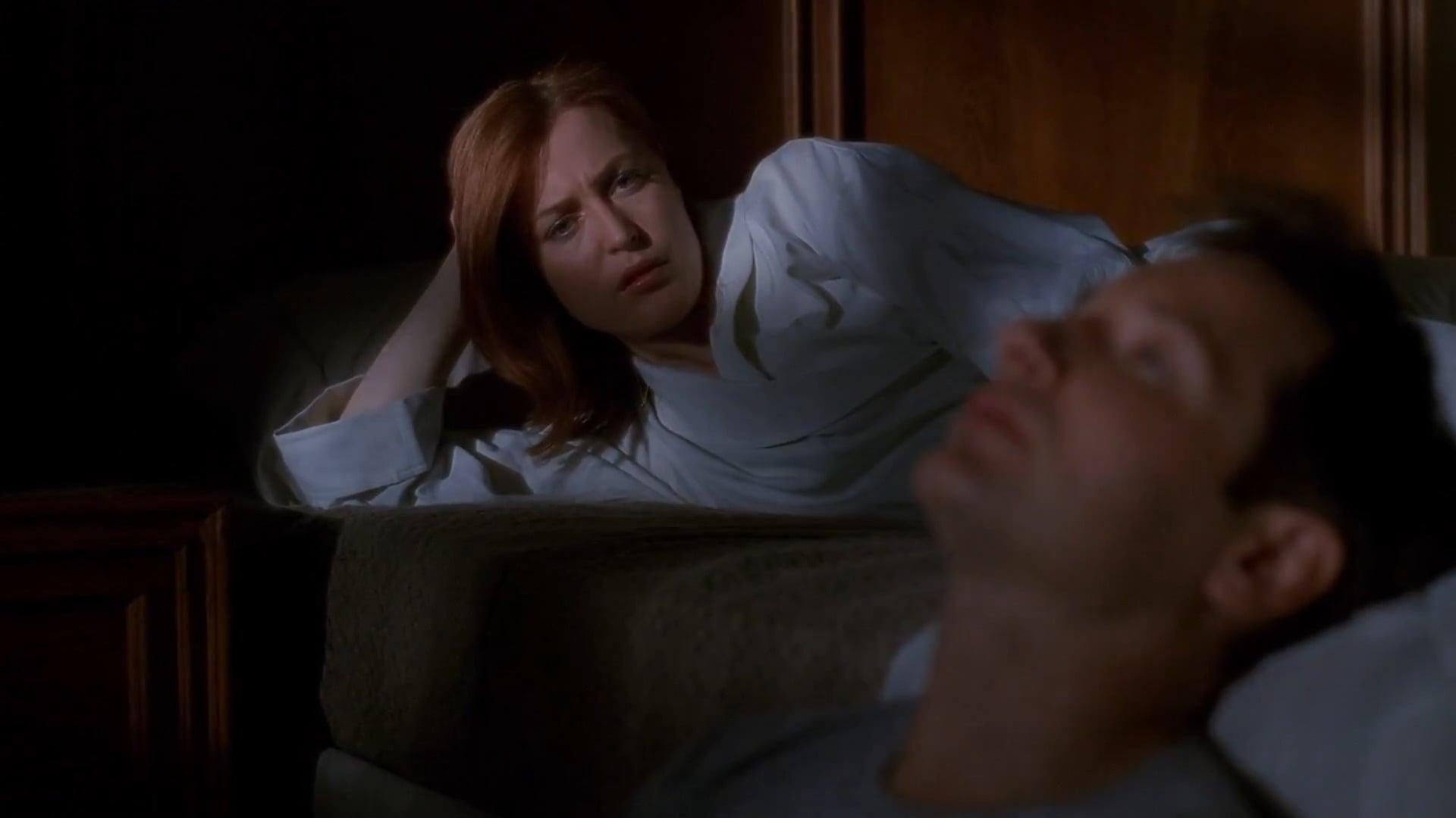 Agent Scully (Gillian Anderson) and Agent Mulder (David Duchovny) reflect on their time with the FBI in The X-Files Season 9 Episode 20 "The Truth" (2001), 20th Century Studios