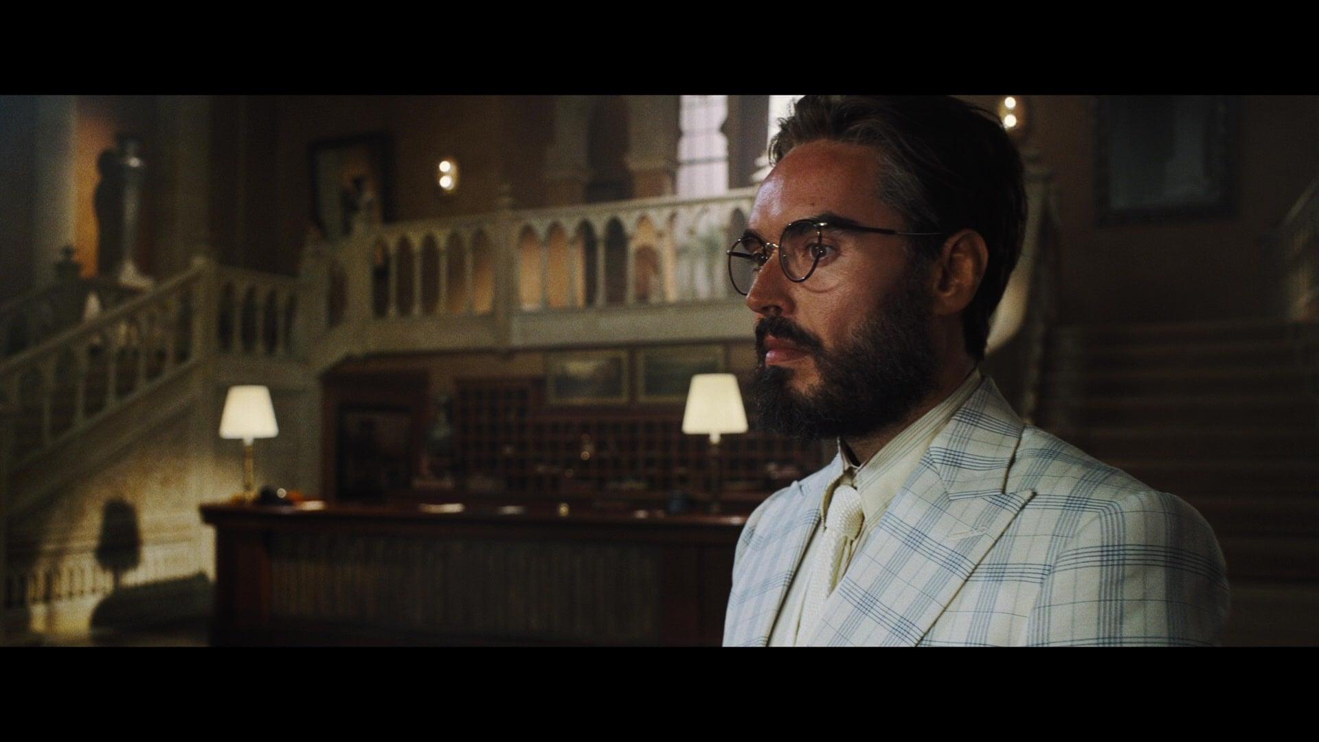 Dr. Windlesham (Russell Brand) steels himself for an uneasy trip in Death on the Nile (2022), 20th Century Studios