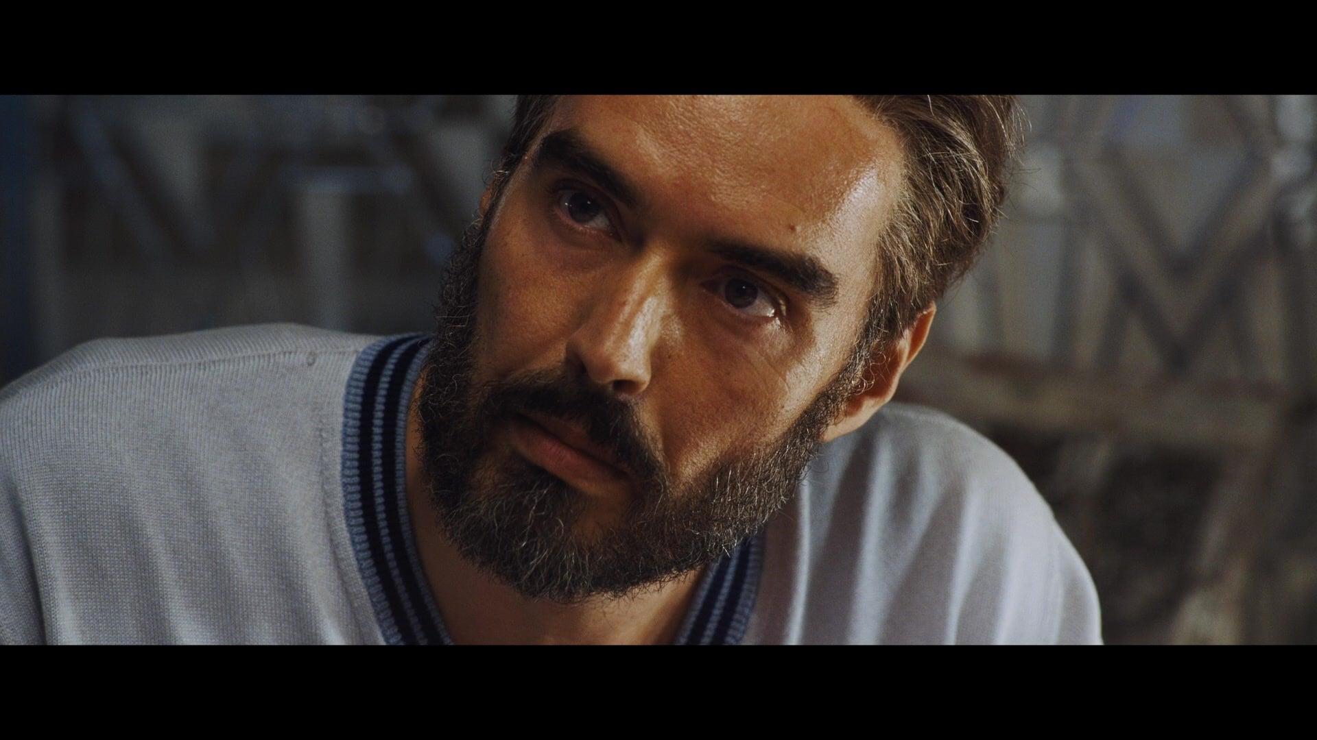 Dr. Windlesham (Russell Brand) is asked some questions by Inspector Poirot (Kenneth Branagh) in Death on the Nile (2022), 20th Century Studios