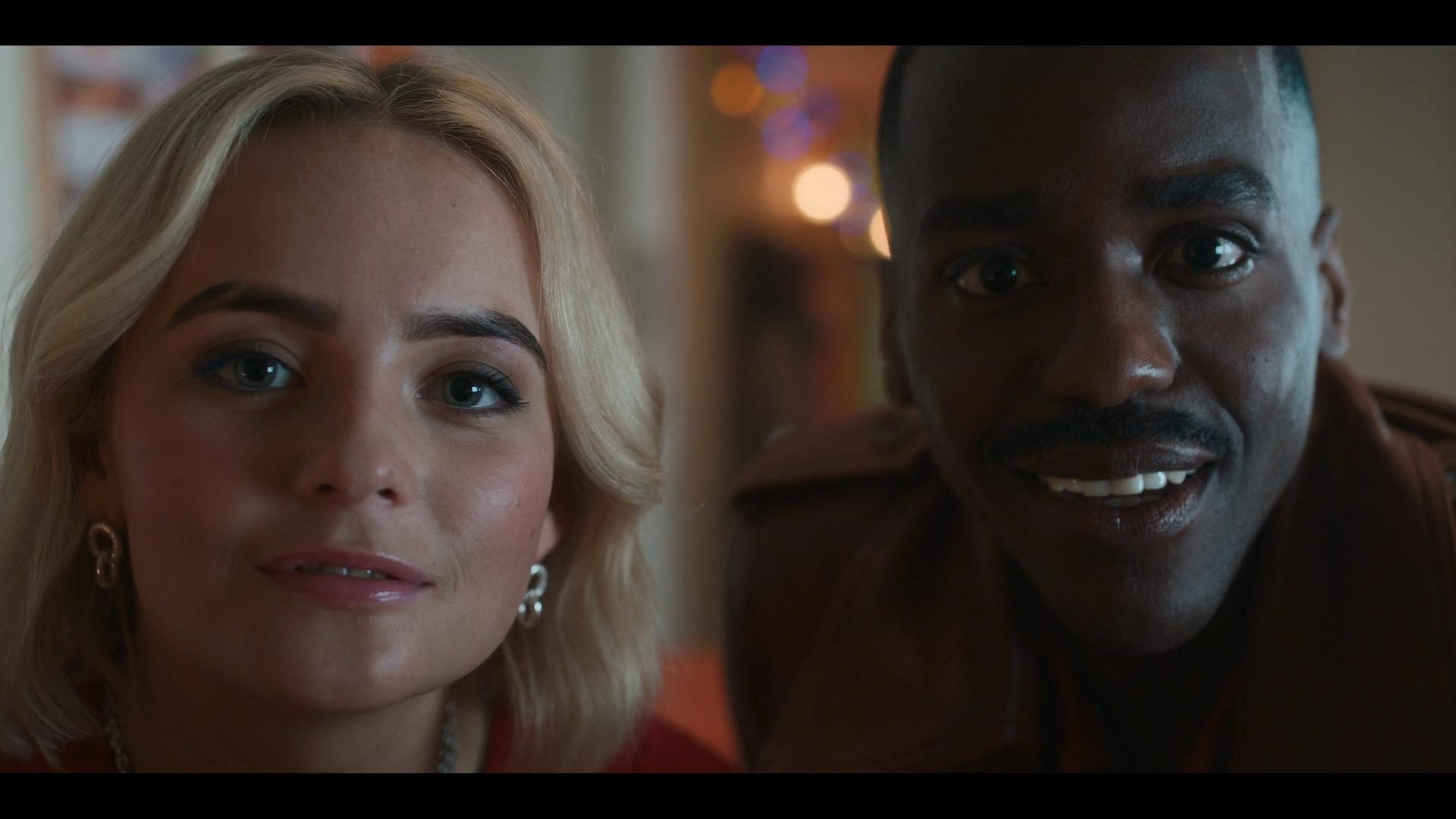 Ruby (Millie Gibson) shows The Doctor (Ncuti Gatwa) her childhood photos in Doctor Who Series 14 Episode 0 "The Church On Ruby Road" (2023), BBC
