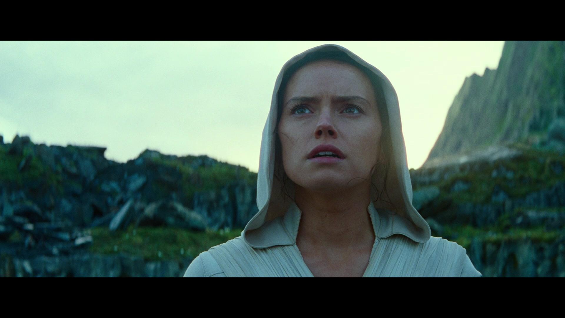Rey (Daisy Ridley) watches on as Luke Skywalker (Mark Hamill) lifts his X-Wing from the waters of Ahch-To in Star Wars: Episode IX - The Rise of Skywalker (2019), Disney