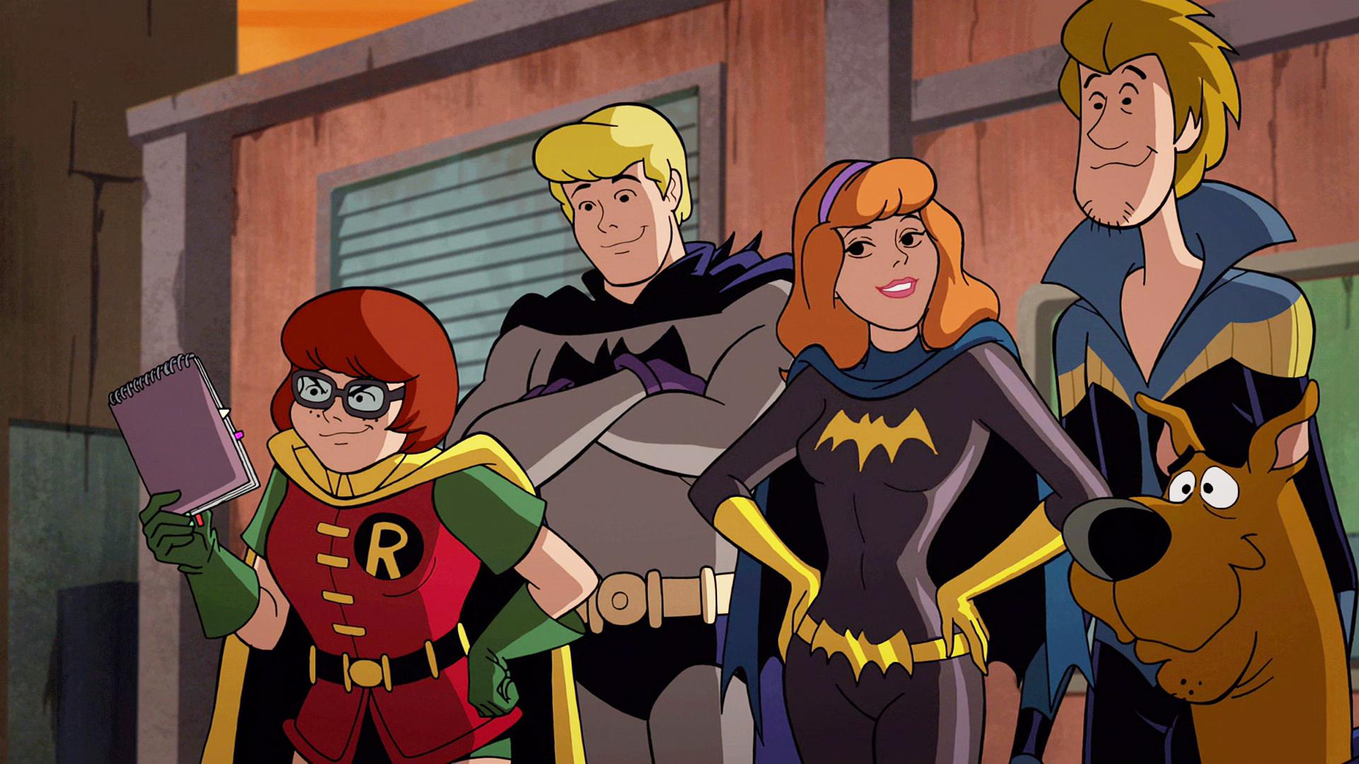 Robin (Kate Micucci), Batman (Frank Welker), Batgirl (Grey Griffin), Nightwing (Matthew Lillard) and Batman (Frank Welker) reveal their true identities in Scooby-Doo! & Batman: The Brave and the Bold (2018), Warner Bros. Animation