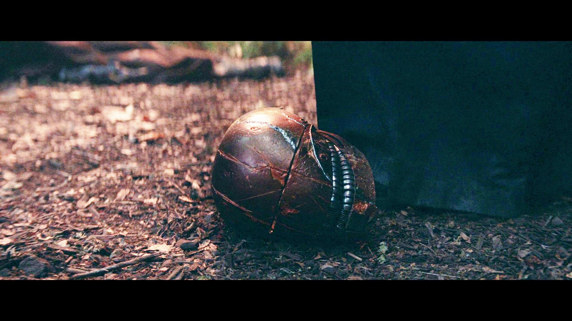 The Stranger (Manny Jacinto) retrieves his helmet in The Acolyte Season 1 Episode 5 "Night" (2024), Disney