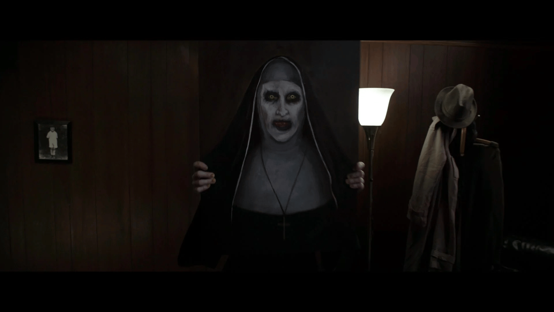 The Nun (Bonnie Aarons) emerges to attack Lorraine Warren (Vera Farmiga) in The Conjuring 2 (2016), New Line Cinema