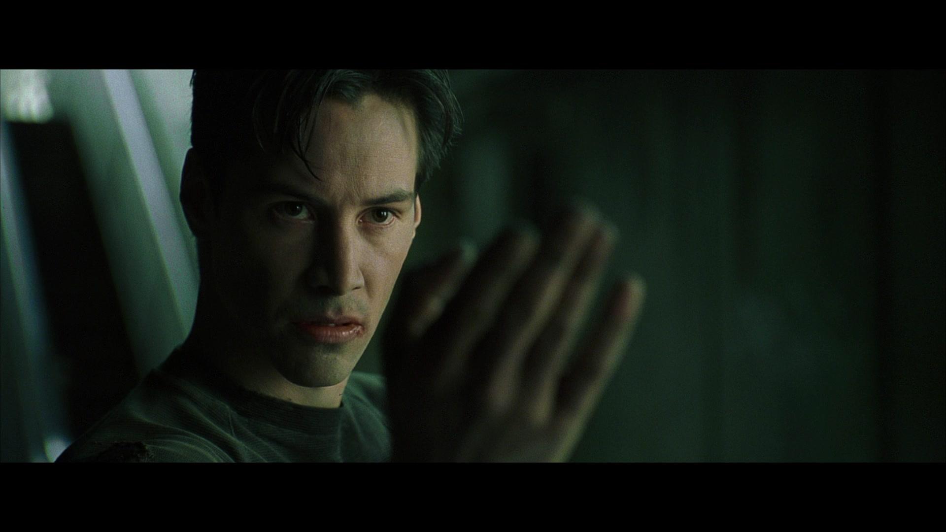 Neo (Keanu Reeves) goads on Agent Smith (Hugo Weaving) in The Matrix (1999), Warner Bros. Pictures