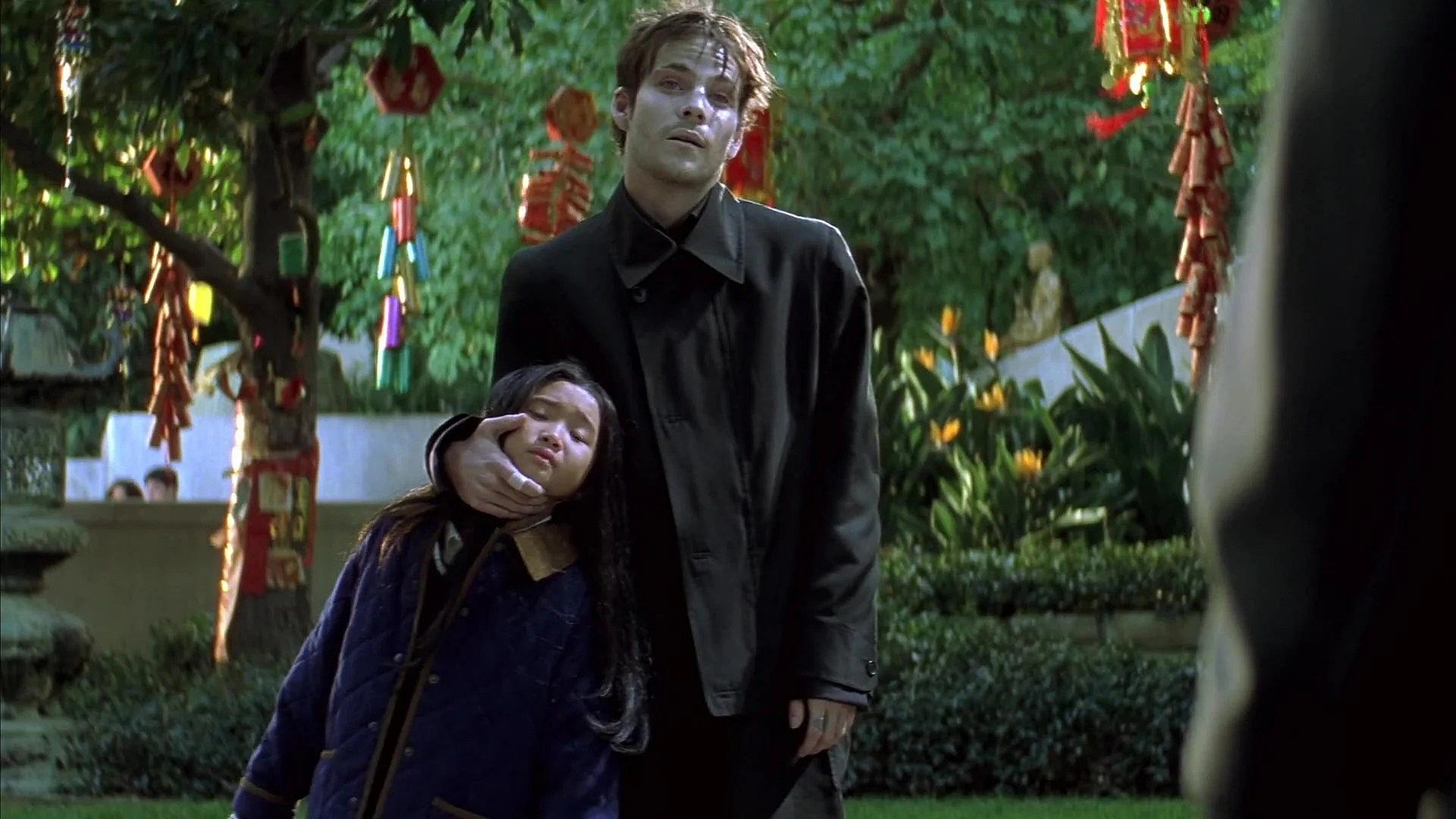 Deacon Frost (Stephen Dorff) threatens a girl to taunt Blade (Wesley Snipes) in Blade (1998)