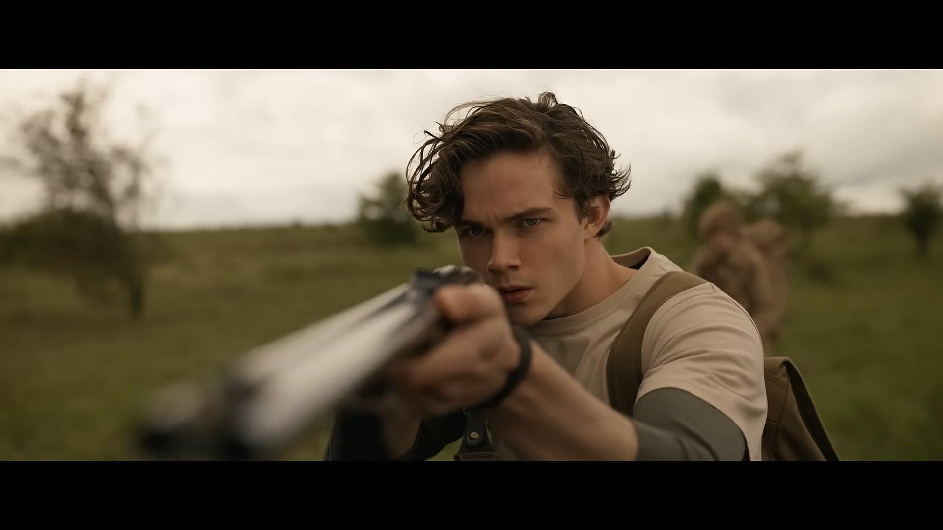 A young Kraven (Levi Miller) takes aim in Kraven the Hunter (2023), Sony Pictures