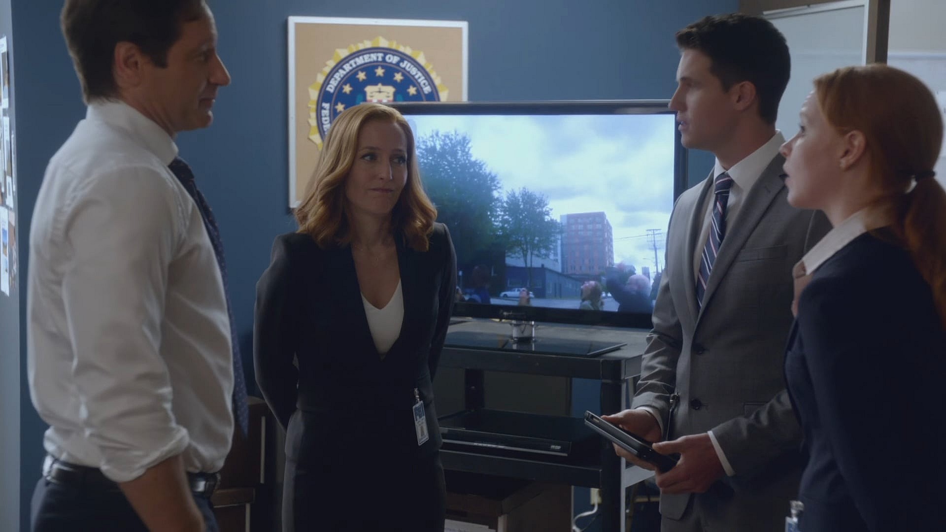 Agent Scully (Gillian Anderson) and Agent Mulder (David Duchovny) find themselves staring into a proverbial mirror in The X-Files Season 10 Episode 5 "Babylon" (2016), 20th Century Studios