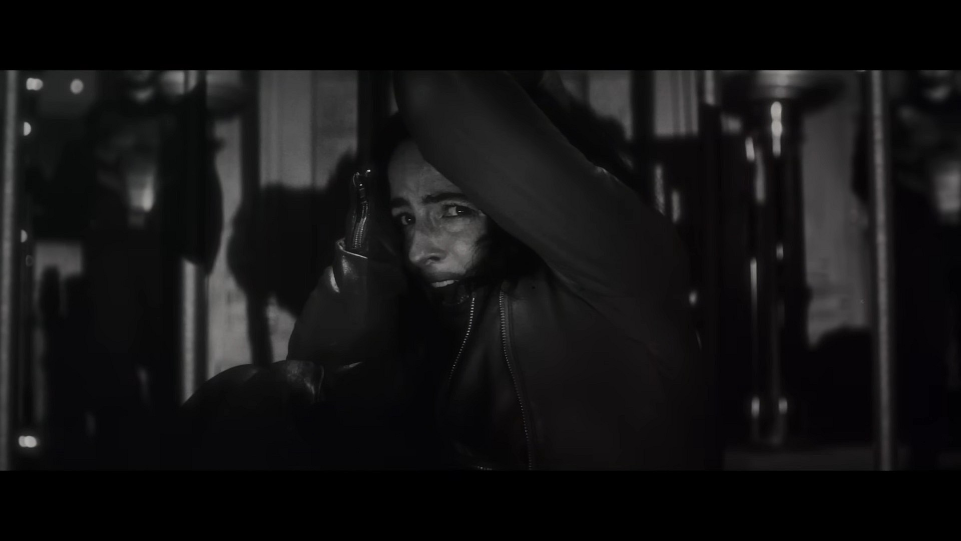 Elsa Bloodstone (Laura Donnelly) recoils in terror as the titular lycan (Gael García Bernal) in Werewolf By Night (2022), Marvel Entertainment