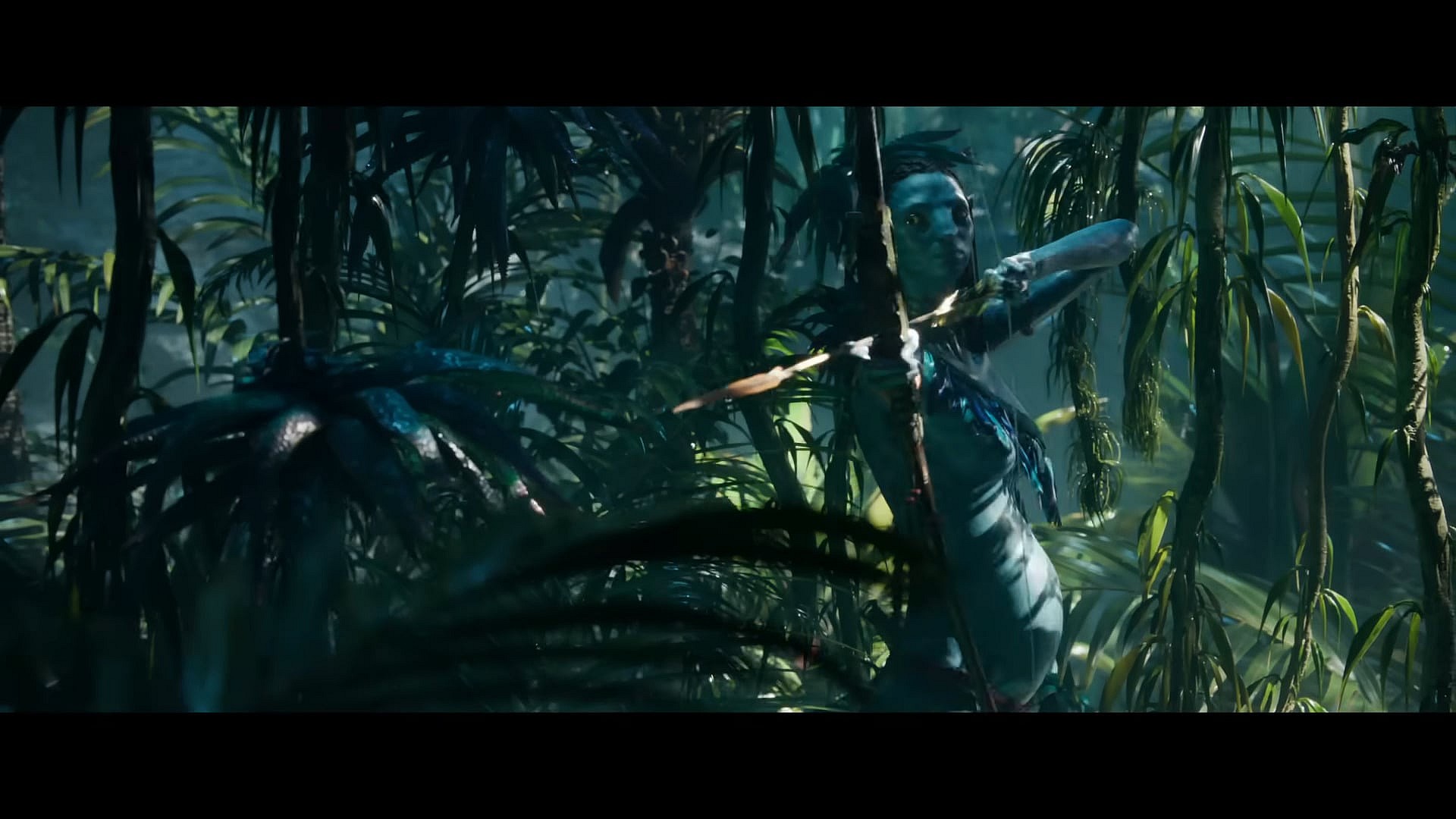A pregnant Neytiri (Zoe Saldaña) takes aim in Avatar: The Way of Water (2022), Disney via YouTube