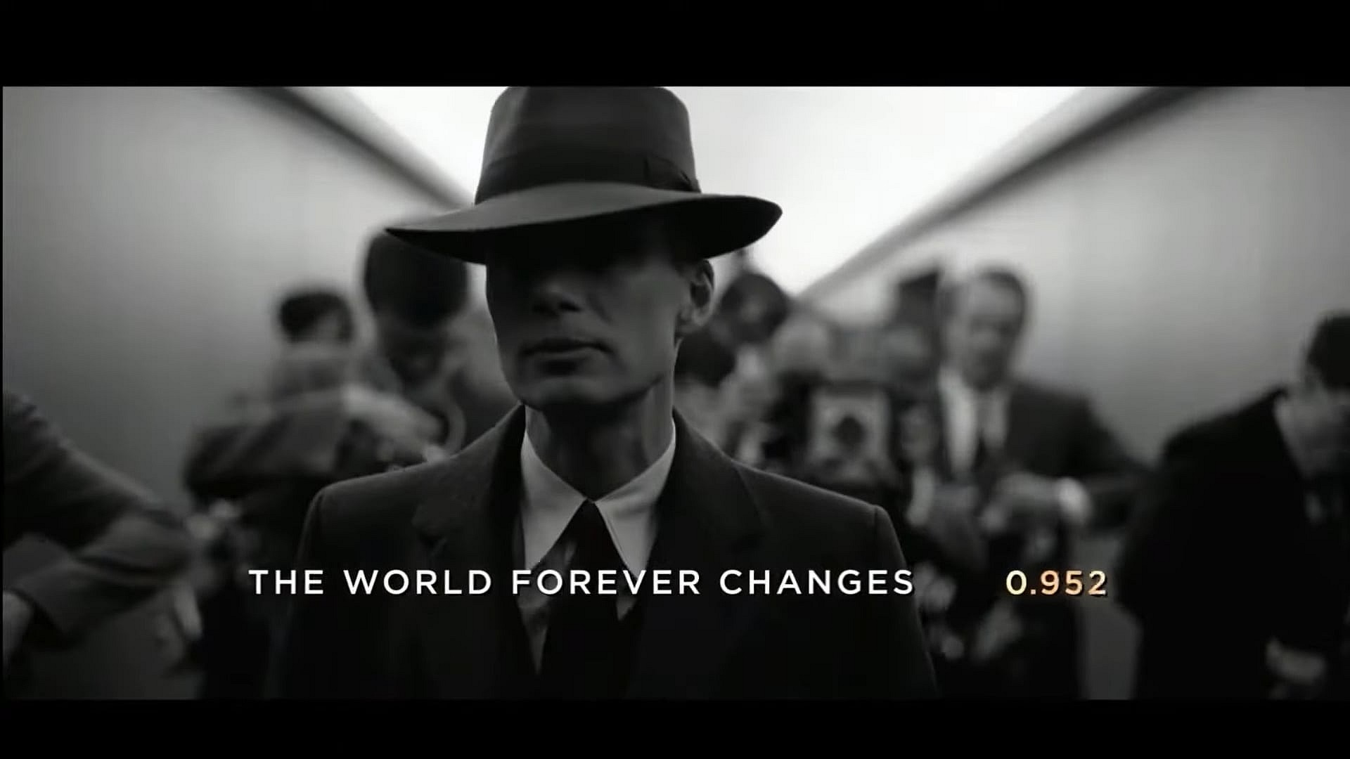 Robert J. Oppenheimer (Cillian Murphy) walks past the press in Oppenheimer (2023), Syncopy Inc.