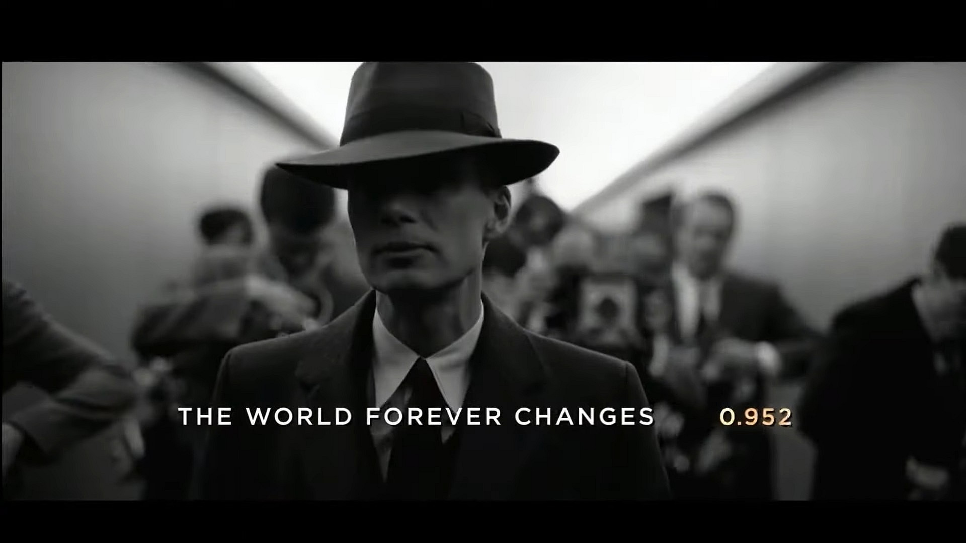 Robert J. Oppenheimer (Cillian Murphy) walks past the press in Oppenheimer (2023), Syncopy Inc.