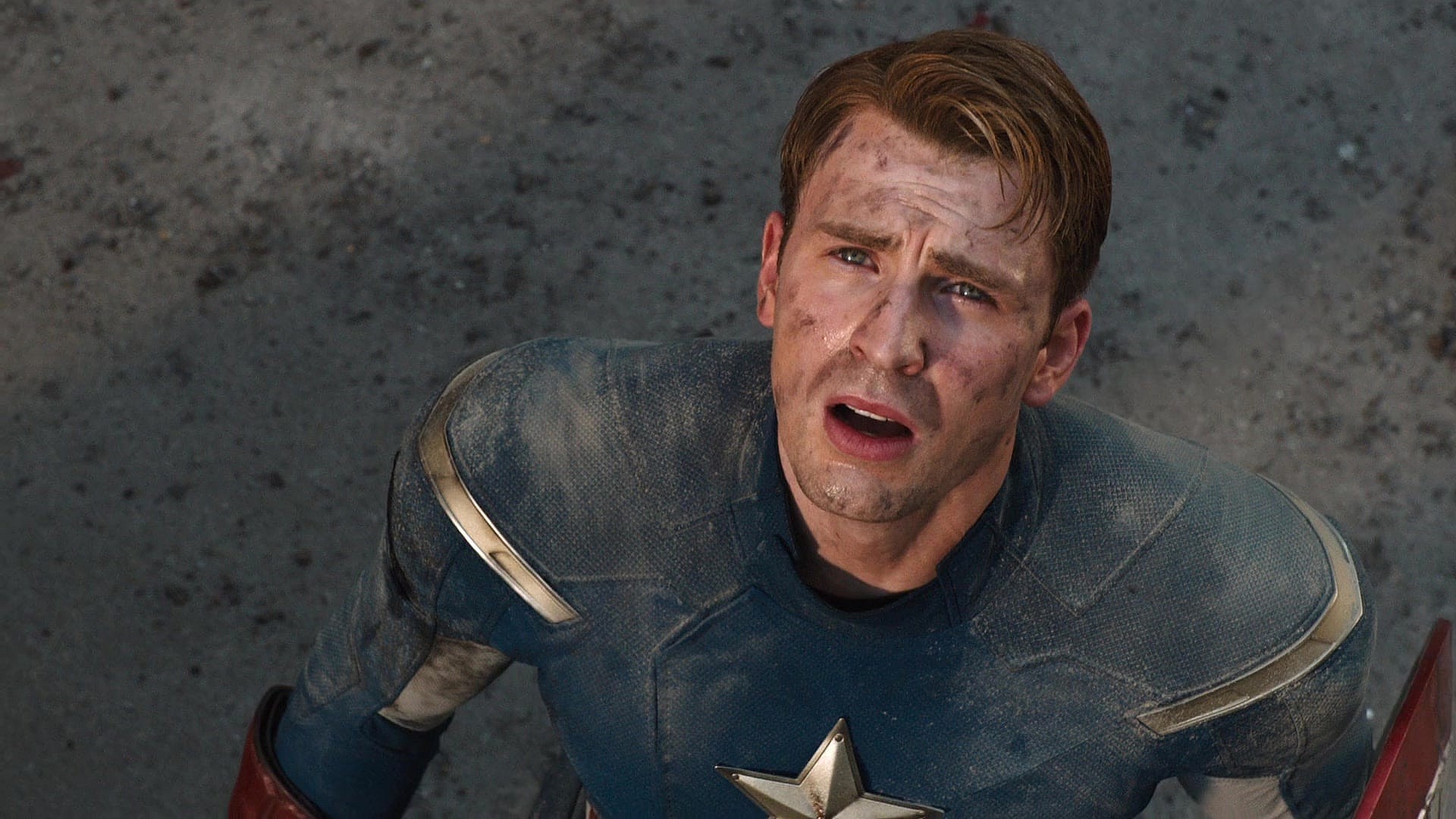 Captain America (Chris Evans) watches on as Iron Man (Robert Downey Jr.) puts an end to The Battle of New York in The Avengers (2012), Marvel Entertainment