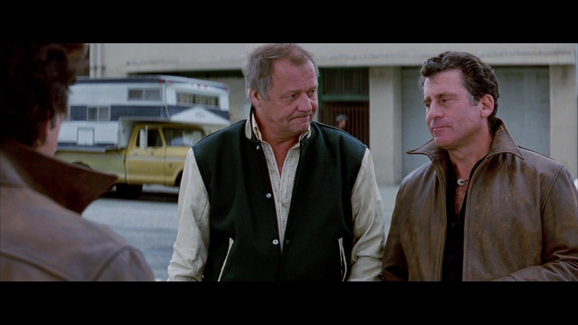 A pair of old detectives (David Soul and Paul Michael Glaser) pass on their classic car in Starsky & Hutch (2004), Warner Bros. Pictures