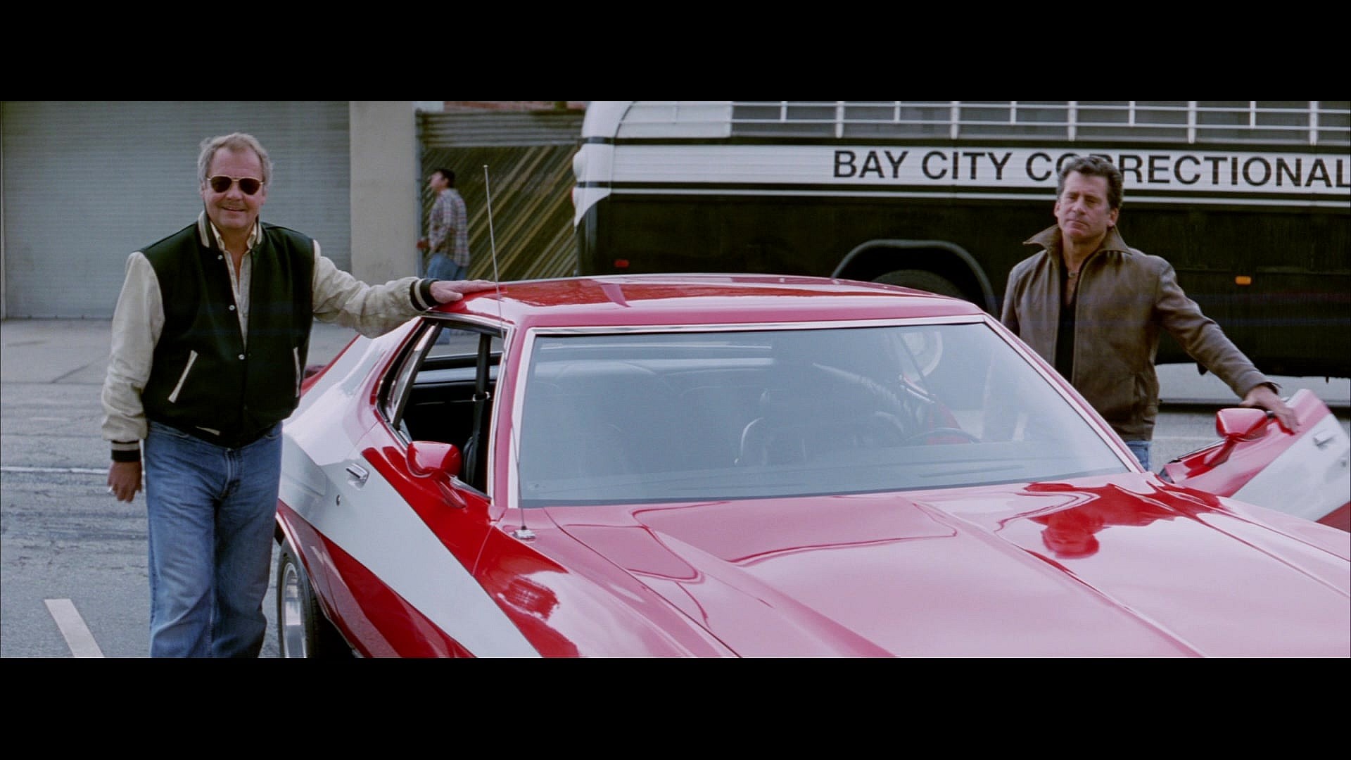 The original Starsky (David Soul) and Hutch (Paul Michael Glaser) arrive with a gift in Starsky & Hutch (2004), Warner Bros. Pictures