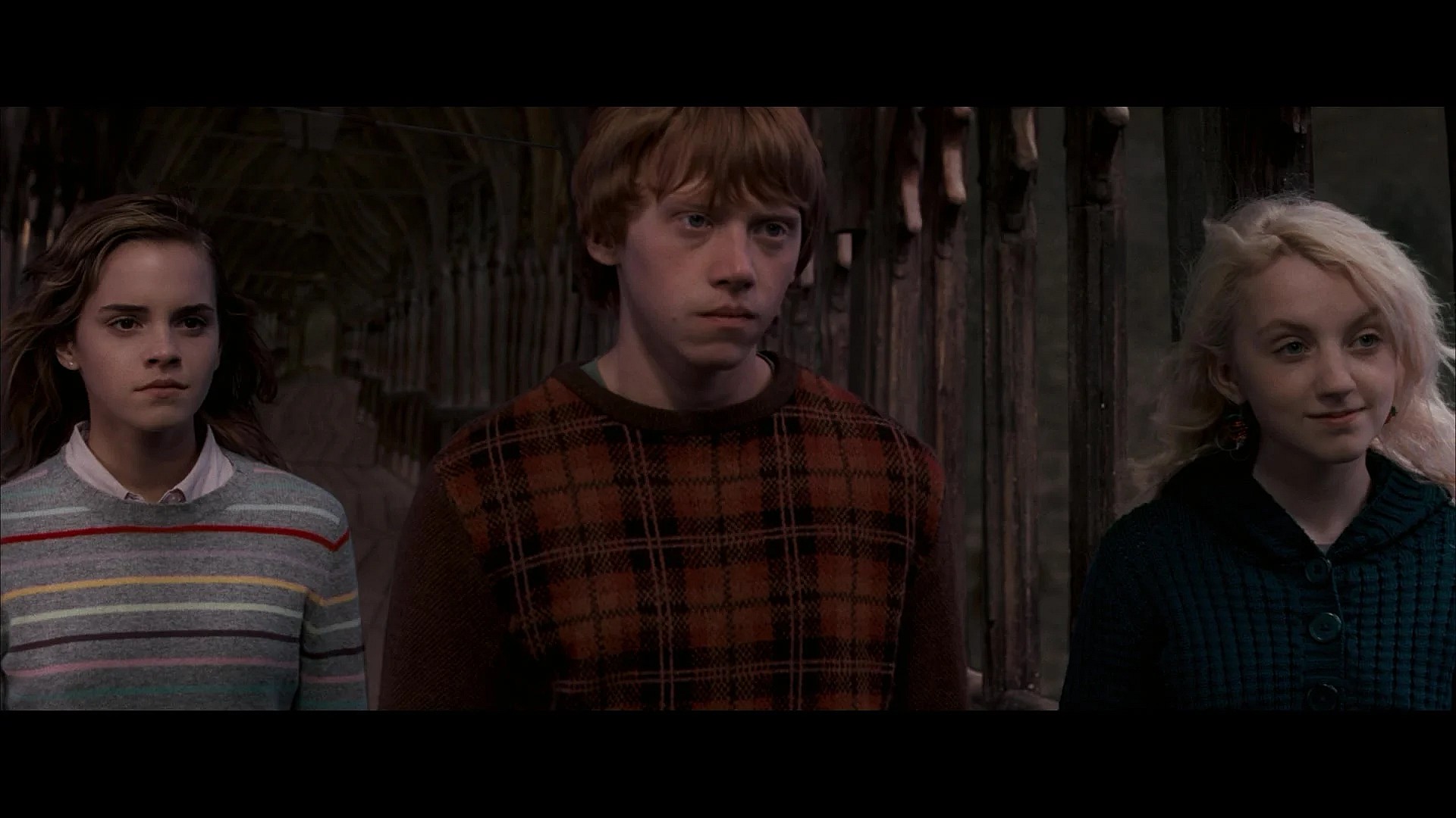 Hermoine Granger (Emma Watson), Ron Weasley (Rupert Grint) and Luna Lovegood (Evanna Lynch) are ready to travel to the Ministry of Magic Department of Mysteries in Harry Potter and the Order of the Phoenix (2007), Warner Bros. Pictures