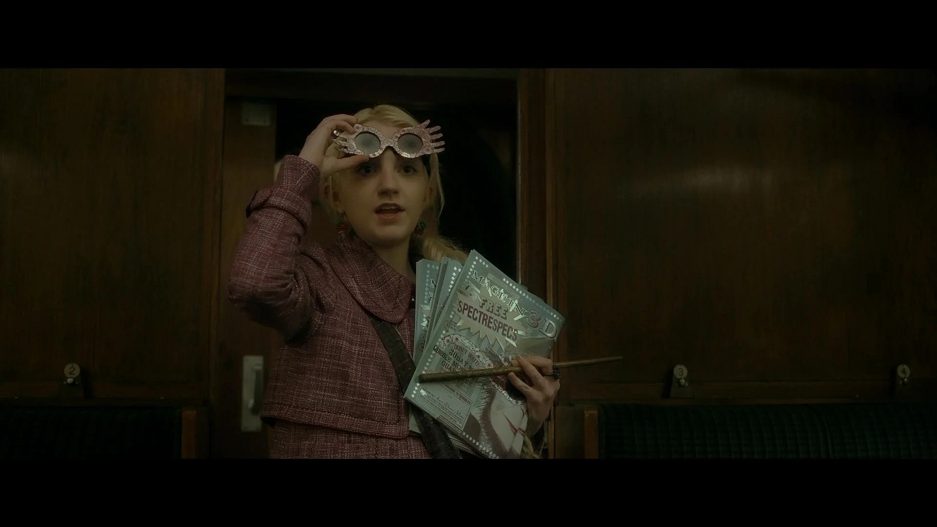 Luna Lovegood (Evanna Lynch) rescues Harry Potter (Daniel Radcliffe) from Draco Malfoy's (Tom Felton) Petrificus Totalus in Harry Potter and the Half-Blood Prince (2009), Warner Bros. Pictures