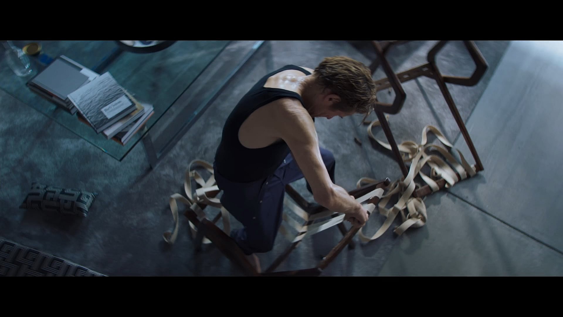 Nemo (Willem Dafoe) begins to construct his tower to freedom in Inside (2023), Focus Features