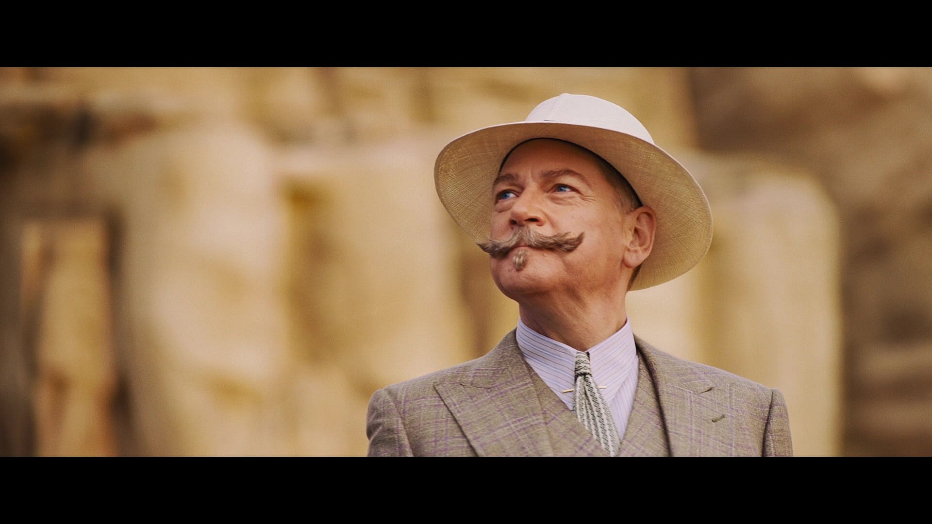 Hercule Poirot (Kenneth Branagh) disembarks from the S.S. Karnak in Death on the Nile (2022), 20th Century Studios Hercule Poirot (Kenneth Branagh) disembarks from the S.S. Karnak in Death on the Nile (2022), 20th Century Studios 