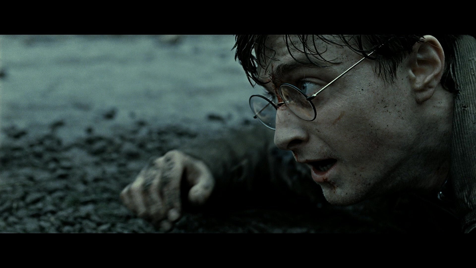 Harry Potter (Daniel Radcliffe) finds himself on the ropes during the Battle of Hogwarts in Harry Potter and the Deathly Hallows - Part 2 (2010), Warner Bros. Pictures