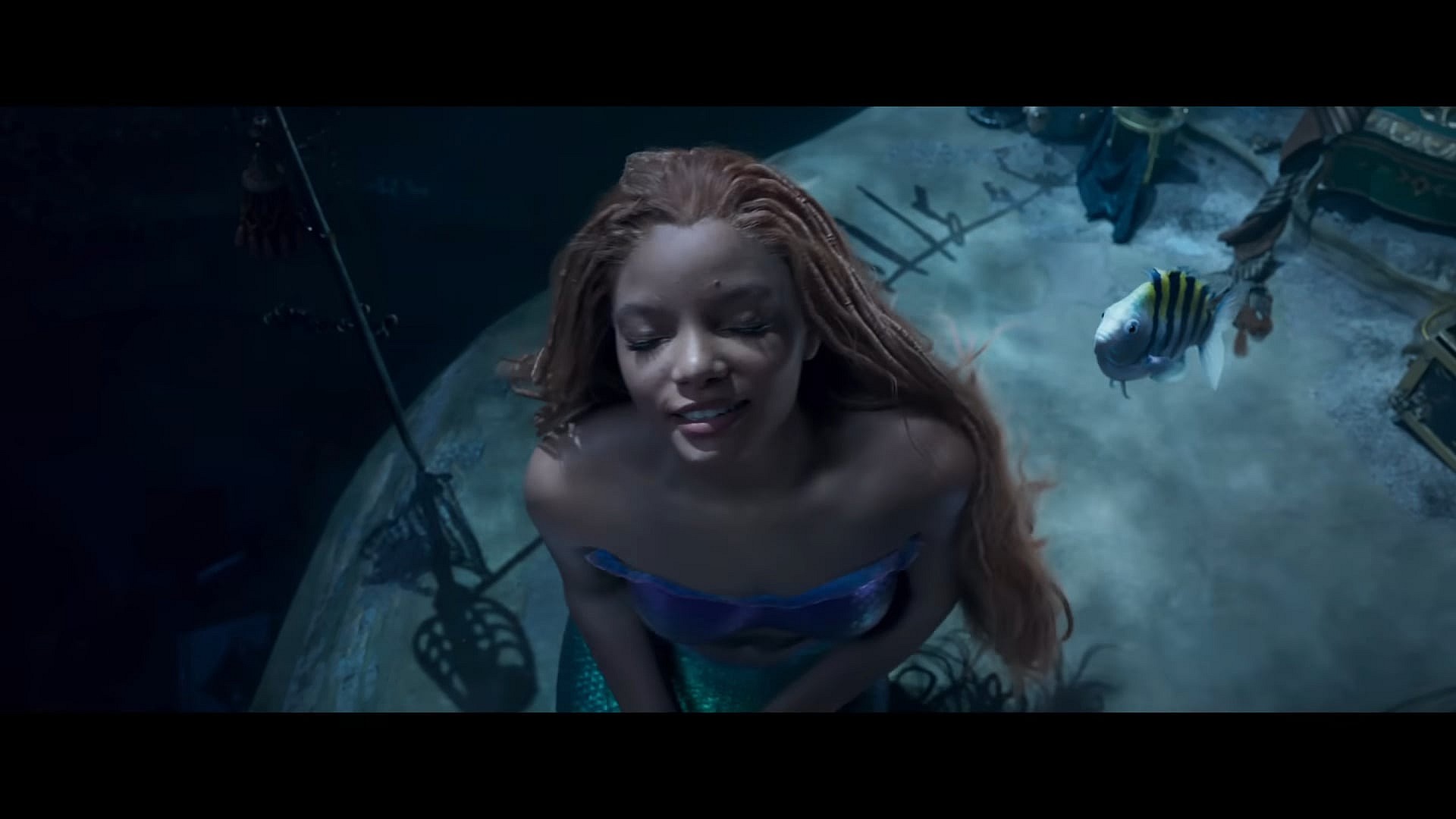Ariel (Halle Bailey) wants to be part of your world in The Little Mermaid (2023), Disney