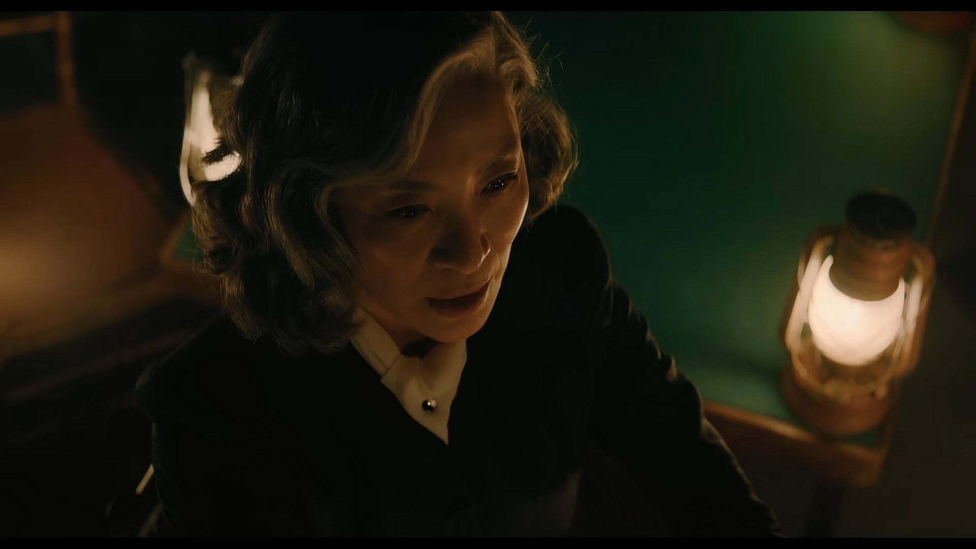 Joyce Reynolds (Michelle Yeoh) commences the seance in A Haunting in Venice (2023), 20th Century Studios