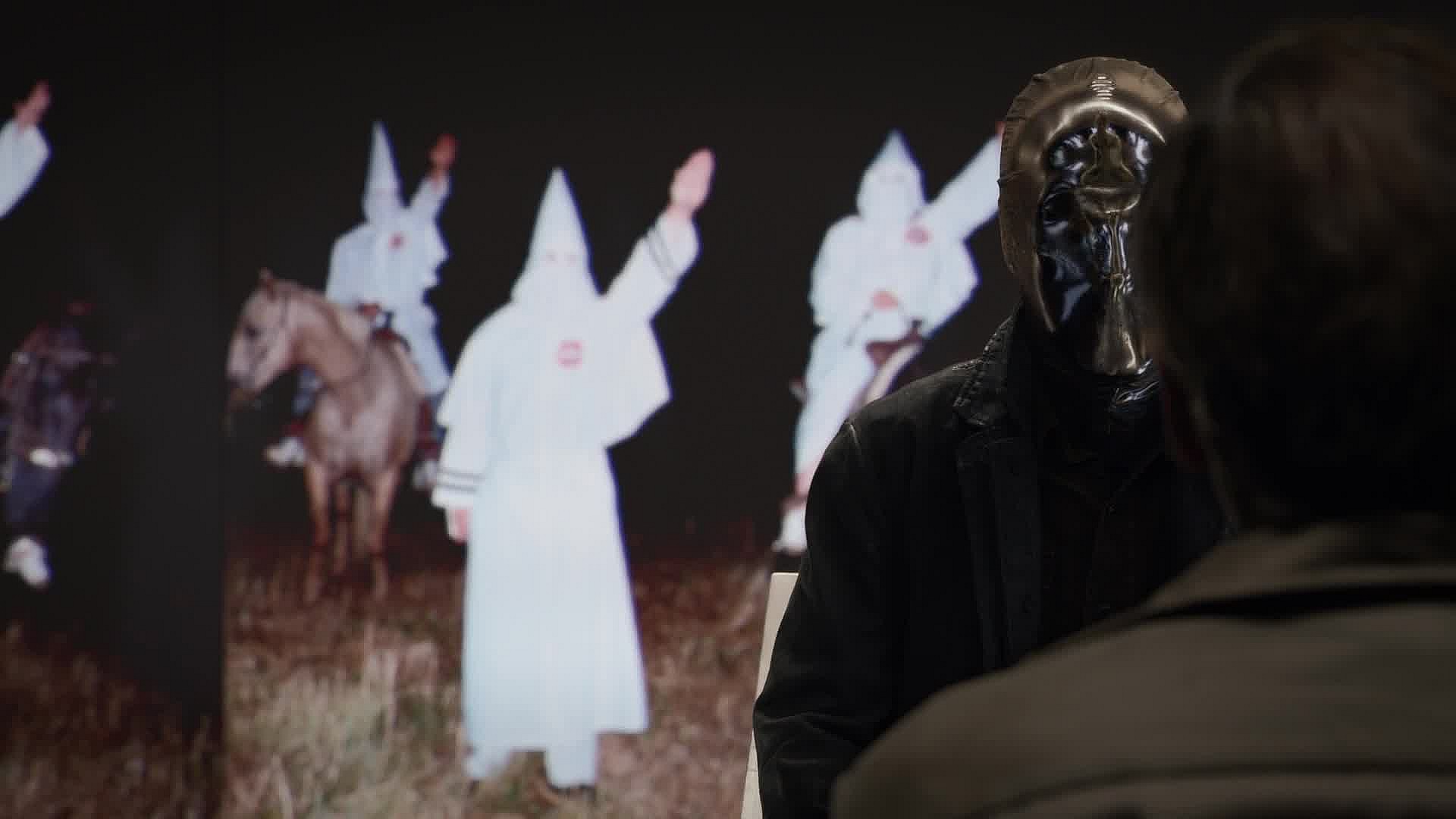 Looking Glass (Tim Blake Nelson) interrogates a suspected member of the white supremacist gang The Kavalry (Wayne Péré) in Watchmen Season 1 Episode 1 "It's Summer and We're Running Out of Ice" (2019), HBO