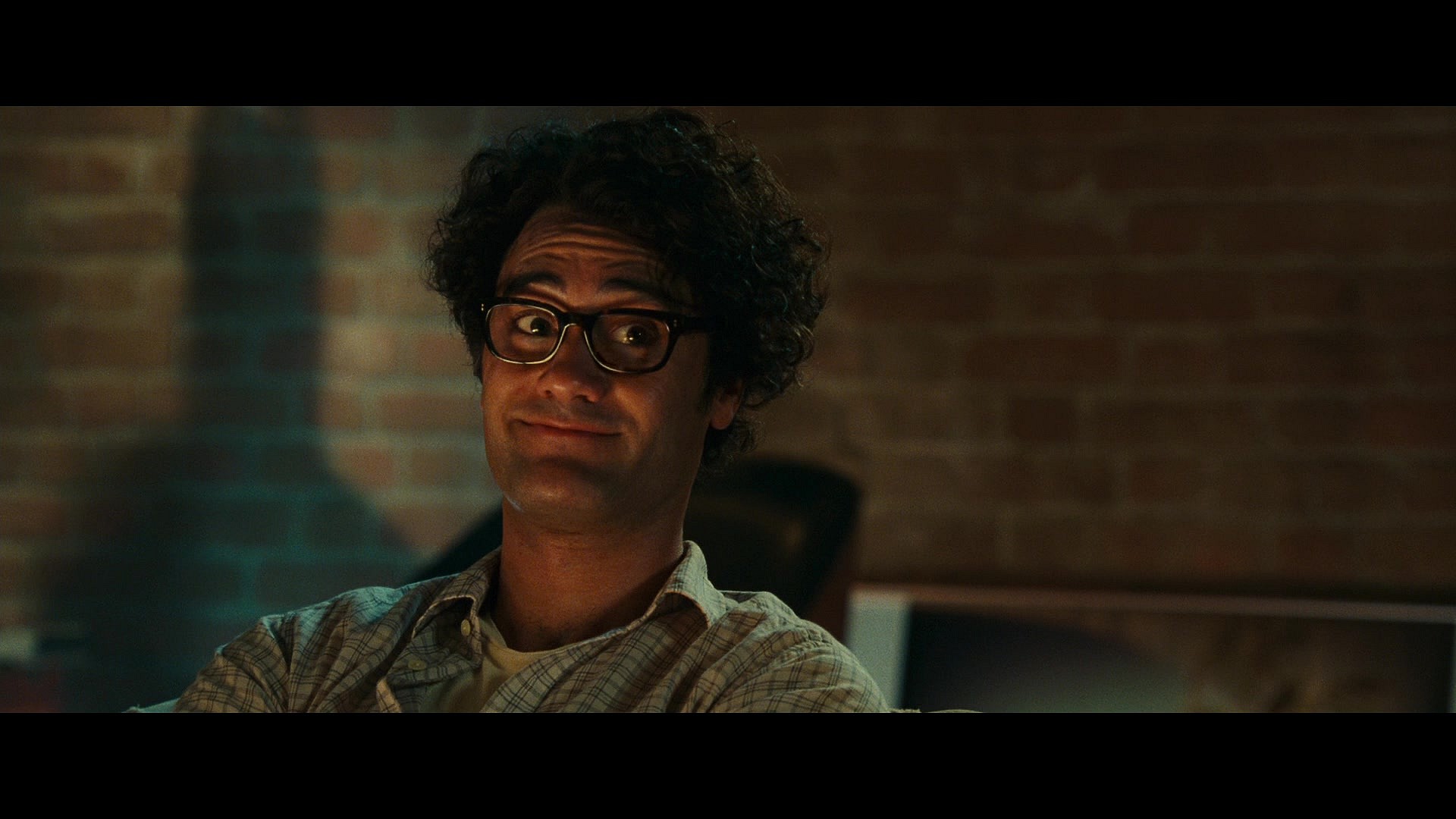 Thomas (Taika Waititi) is about to be entrusted with Hal Jordan's (Ryan Reynolds) new secret in Green Lantern (2011), Warner Bros. Pictures