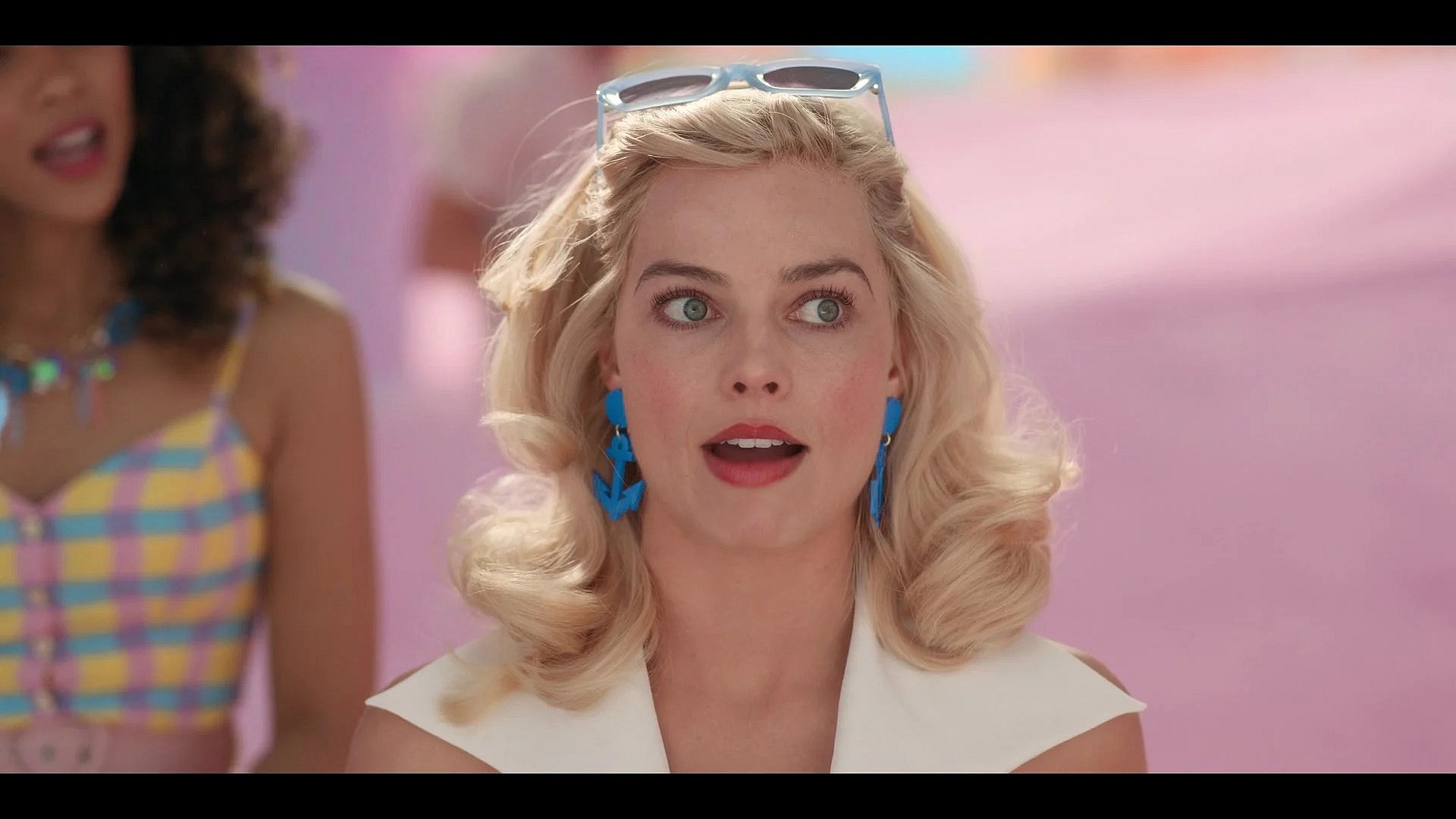 Barbie (Margot Robbie) recounts her recent weirdness in Barbie (2023), Warner Bros. Pictures