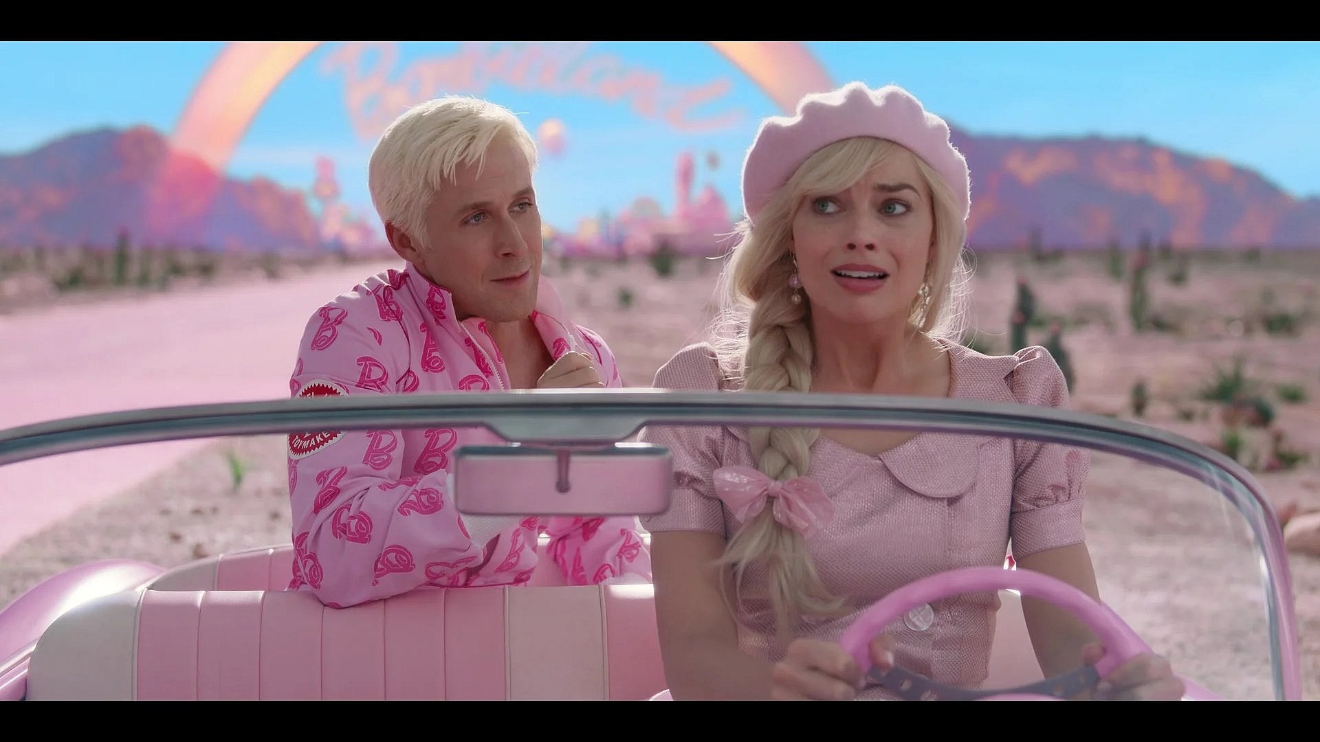 Barbie (Margot Robbie) is surprised to find Ken (Ryan Gosling) was stowing away in her car in Barbie (2023), Warner Bros. Pictures