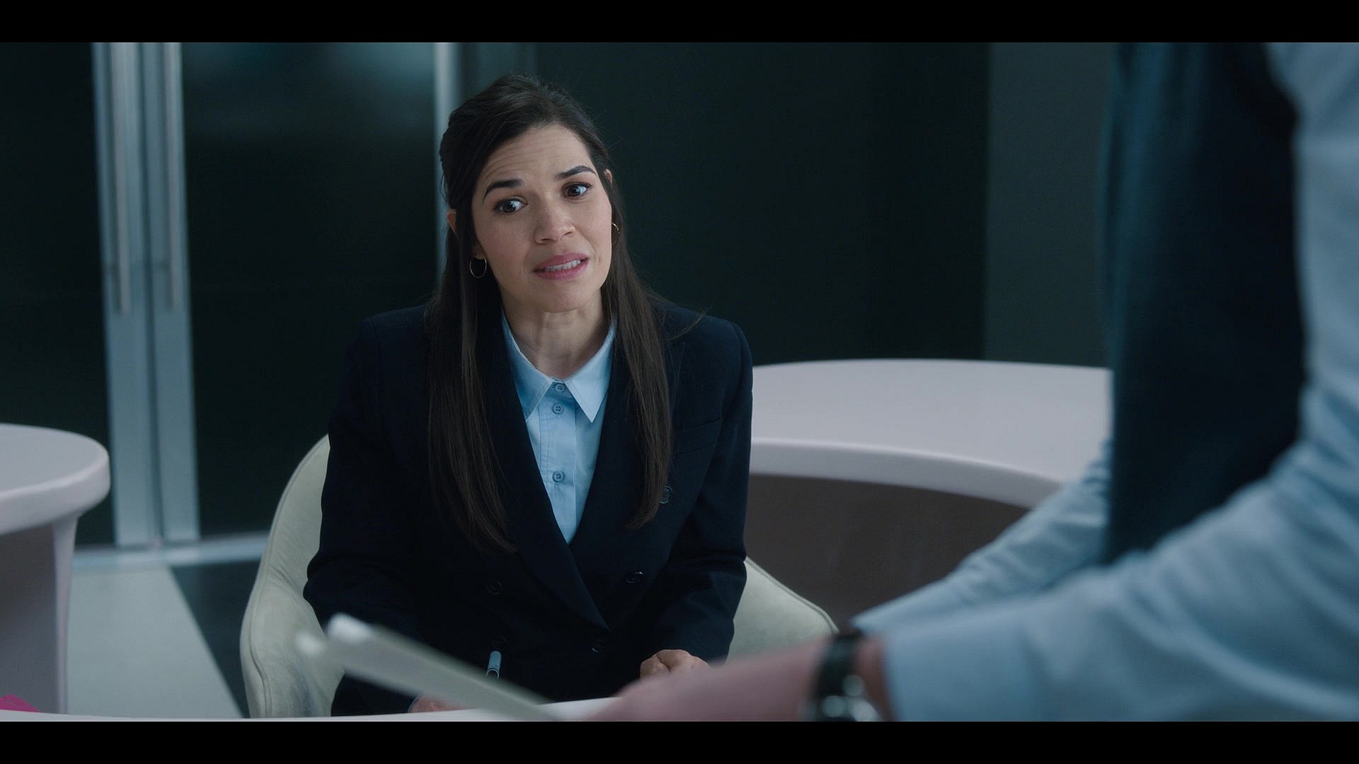 Gloria (America Ferrera) realizes she's been doodling some quite dark Barbie designs in Barbie (2023), Warner Bros. Pictures