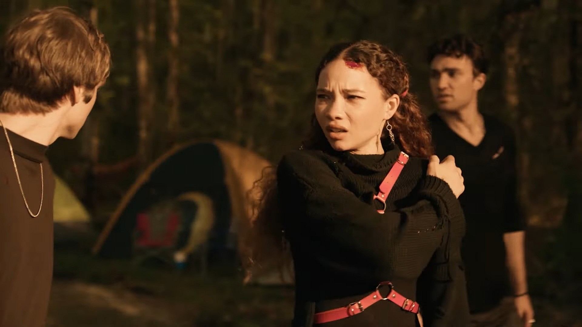 Ash (Ashley Moore) is unnerved by her current surroundings in Festival of the Living Dead (2024), TUBI