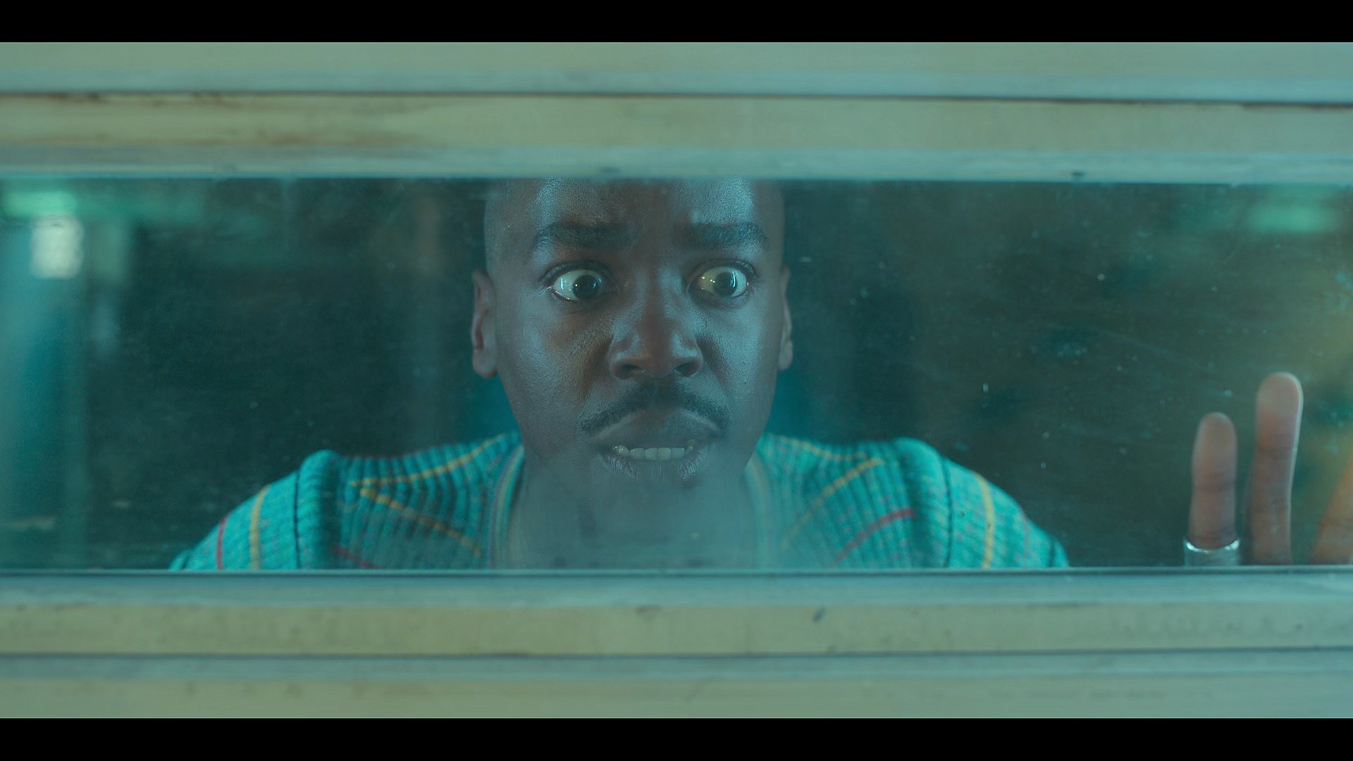 The Doctor (Ncuti Gatwa) watches on as the Bogeyman (Robert Strange) meets its end in Doctor Who Series 14 Episode 1 "Space Babies" (2024), BBC