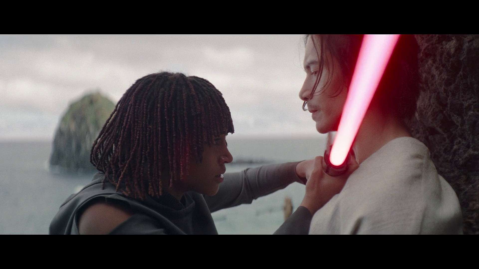 Osha (Amandla Stenberg) brings Qimir's (Manny Jacinto) lightsaber to his own throat in The Acolyte Season 1 Episode 6 'Teach/Corrupt' (2024), Disney