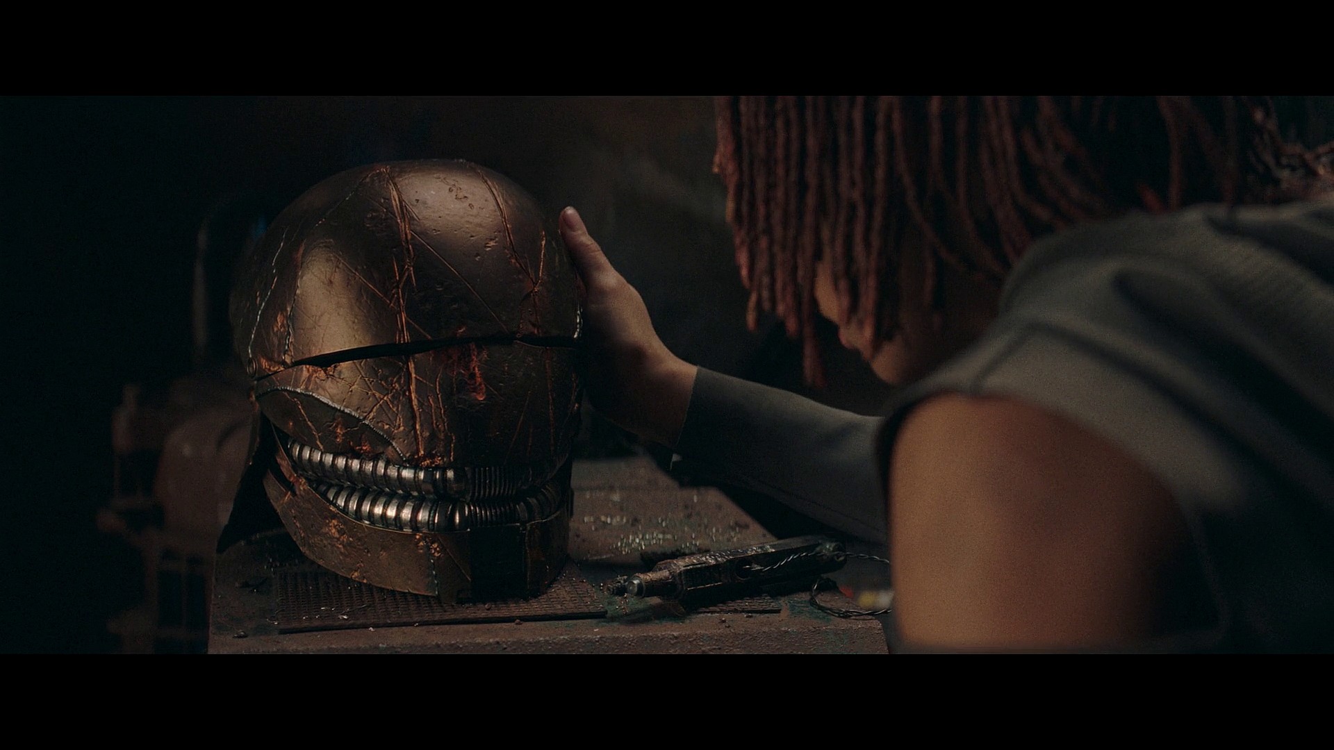 Osha (Amandla Stenberg) finds herself entranced with Qimir's (Manny Jacinto) helmet in The Acolyte Season 1 Episode 6 'Teach/Corrupt' (2024), Disney