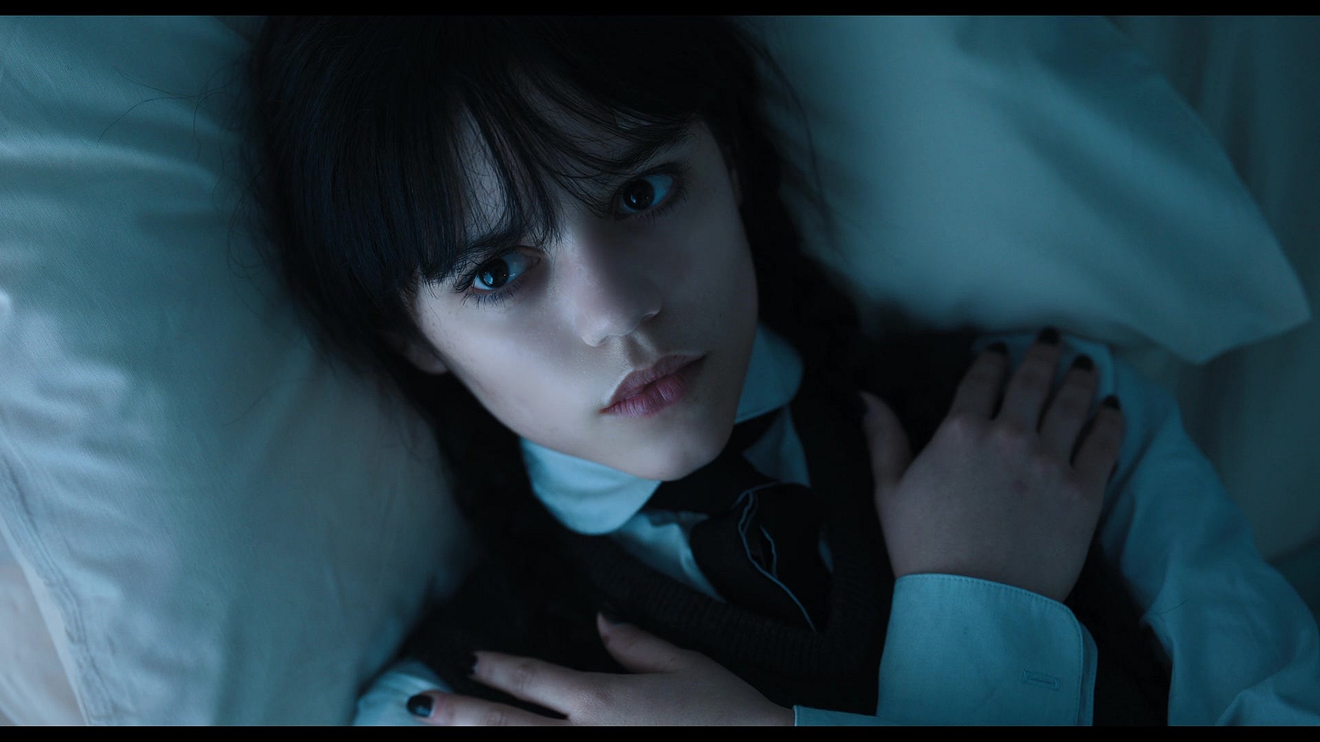 Wednesday (Jenna Ortega) awakens from a nap in Wednesday Season 1 Episode 1 "Wednesday's Child Is Full Of Woe" (2022), Netflix