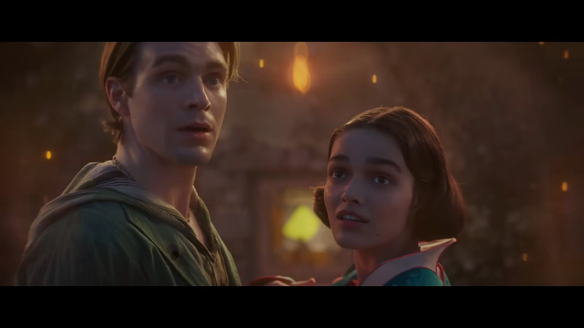 Jonathan (Andrew Burnap) and Snow White (Rachel Zegler) are interrupted from sharing a kiss in Snow White (2025), Disney