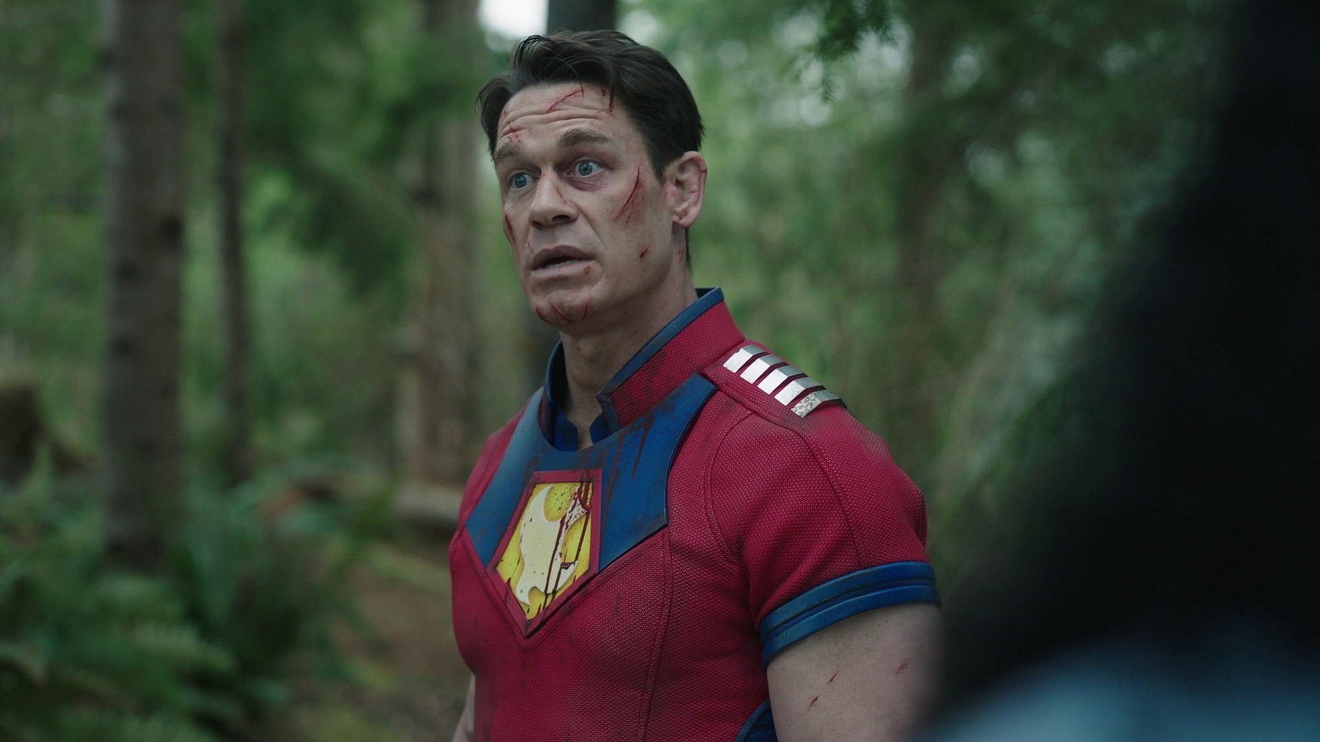 Peacemaker (John Cena) encounters a vision of his father Auggie (Robert Patrick) in Peacemaker Season 1 Episode 8 "It's Cow or Never" (2021), Warner Bros. Entertainment via HBO Max