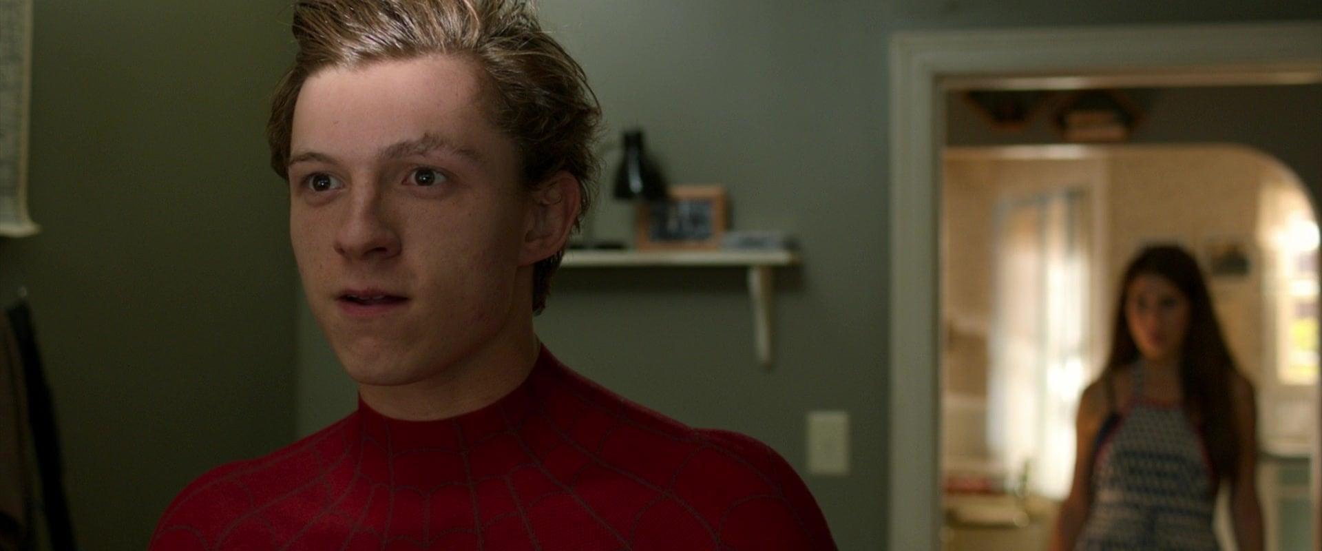 Aunt May (Marissa Tomei) discovers Peter Parker's (Tom Holland) secret identity in Spider-Man: Homecoming (2017), Marvel Entertainment