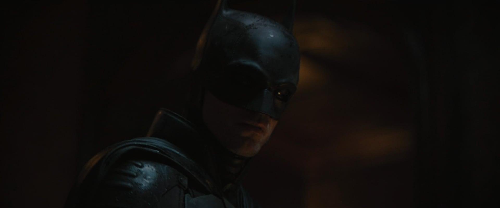 Batman (Robert Pattinson) solves The Riddler's (Paul Dano) first riddle in The Batman (2022), Warner Bros. Pictures
