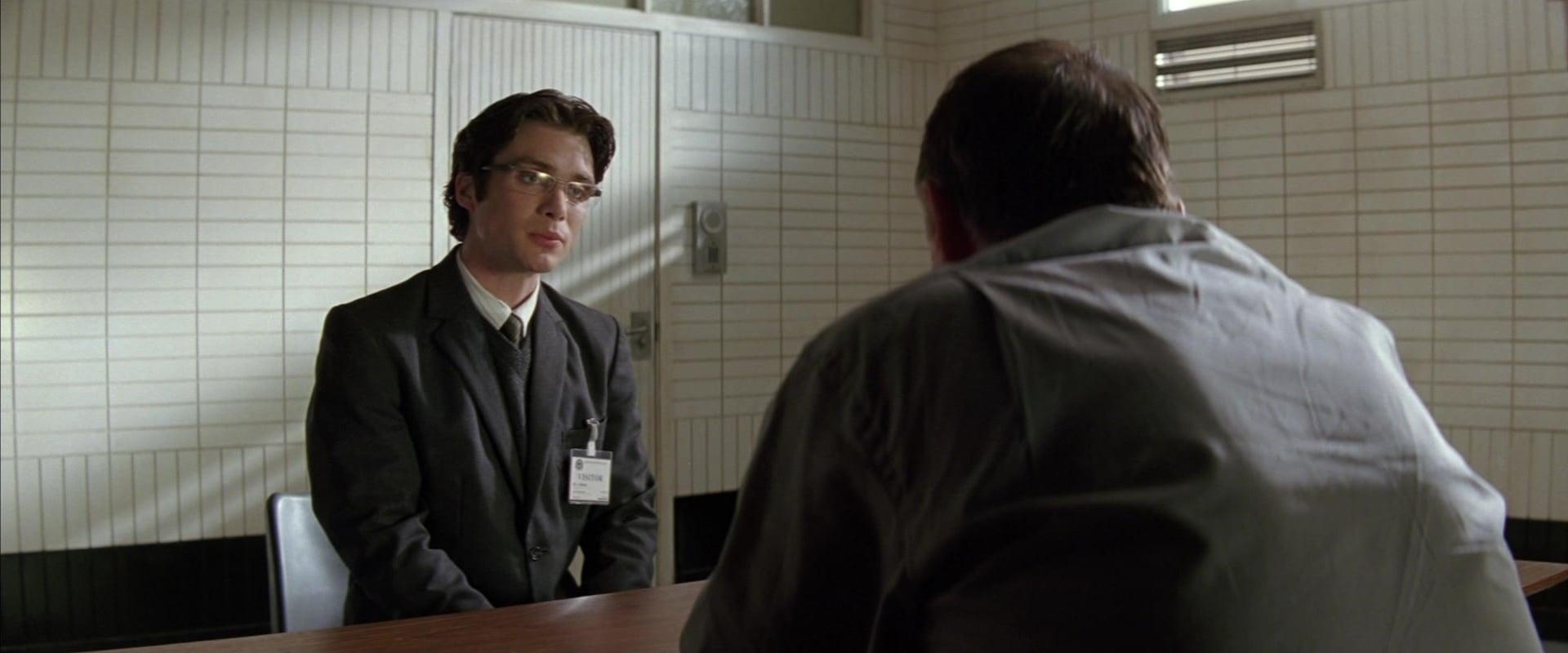 Cillian Murphy as Dr. Jonathan Crane:Scarecrow and Tom Wilkinson as Carmine Falcone in Batman Begins (2005), Warner Bros. Pictures