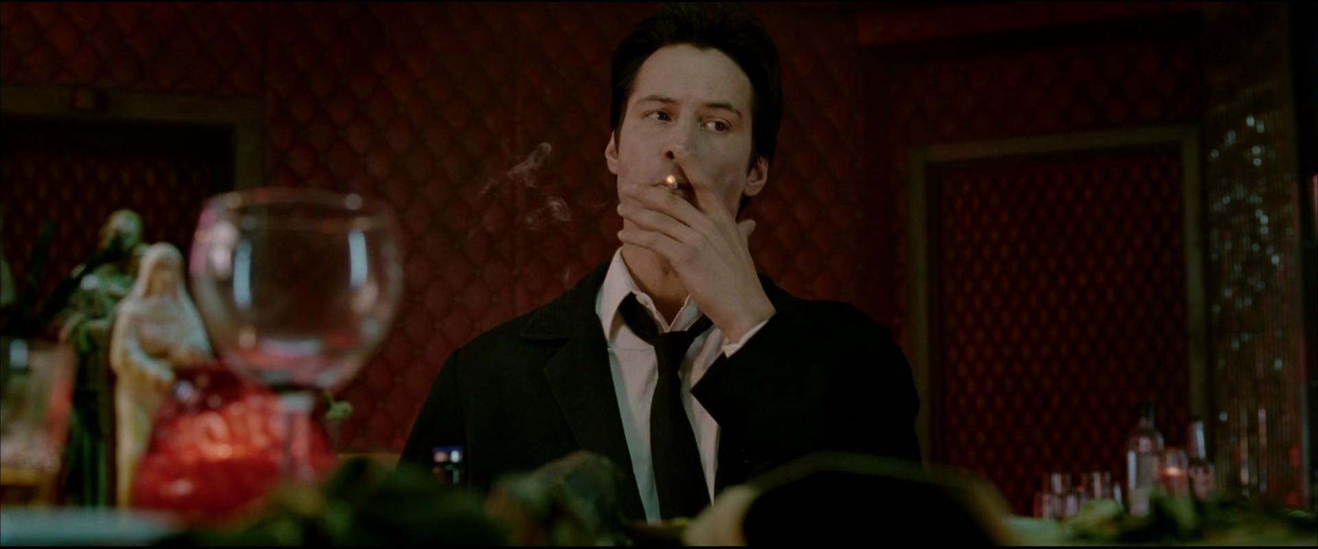 John Constantine (Keanu Reeves) mets with Papa Midnite (Djimon Hounsou) in Constantine (2005), Warner Bros. Pictures