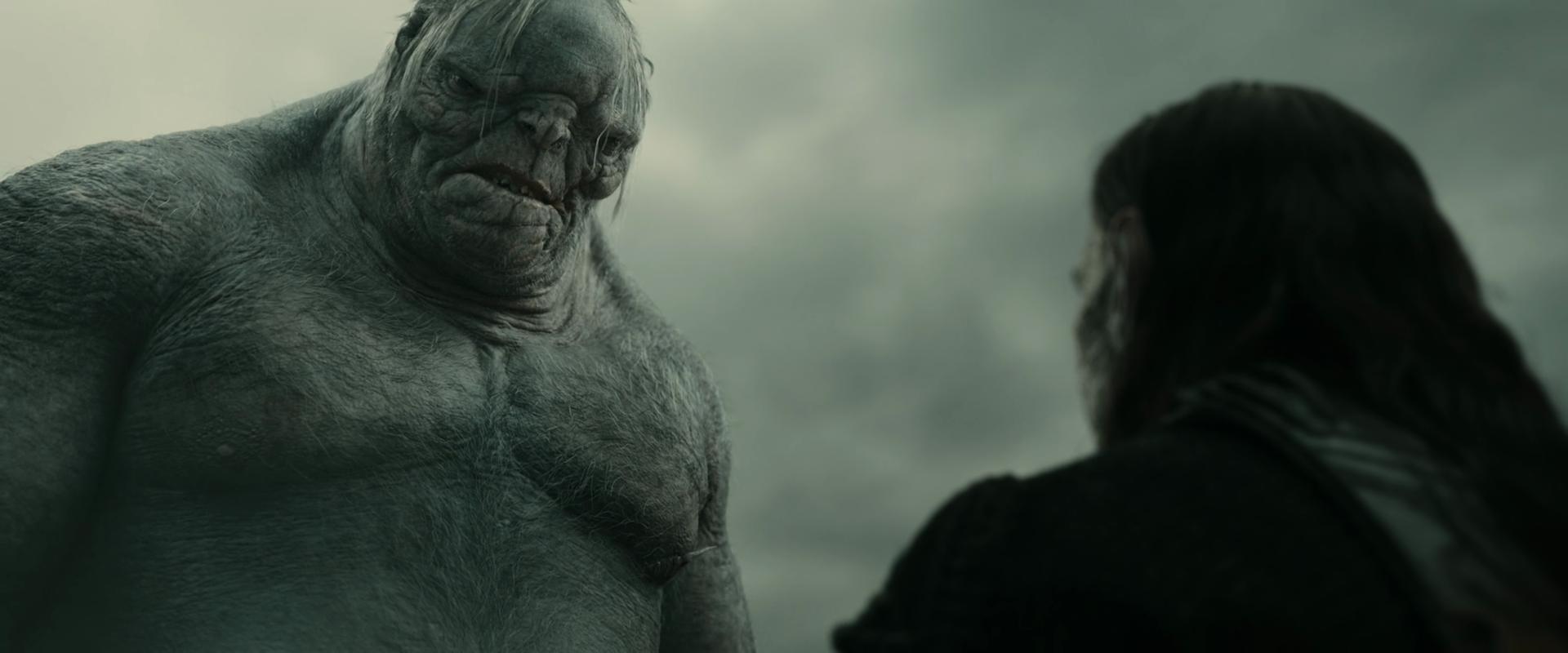 The troll Damrod (Benjamin Walker) scoffs at Adar's (Joseph Mawle) orders in The Lord of The Rings: The Rings of Power Season 2 Episode 3 " The Eagle and The Sceptre" (2024), Amazon Prime